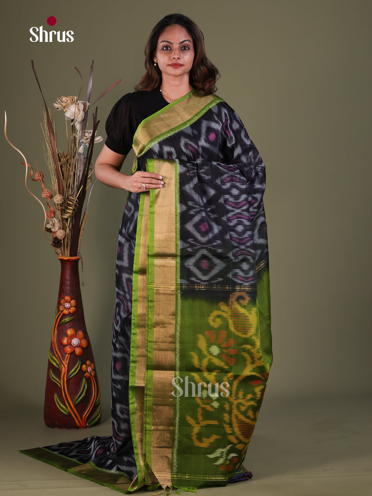 Adoring Black Pochampally Silk Cotton Saree With Elephant Prints & Olive Kaddi Border