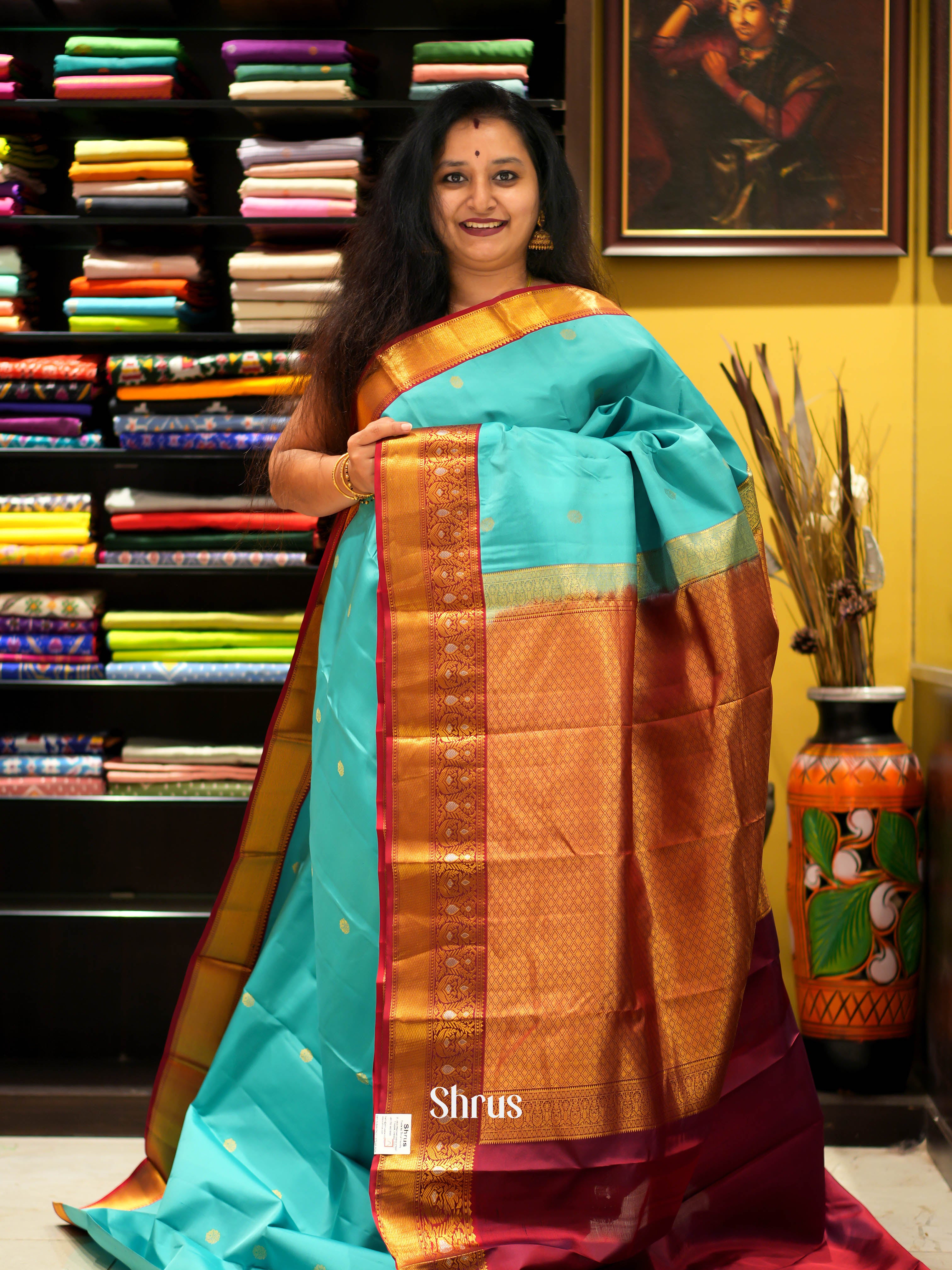 Teal and Maroon Bridal Kanchipuram Silk Saree With Zari Buttas Across The Body-1