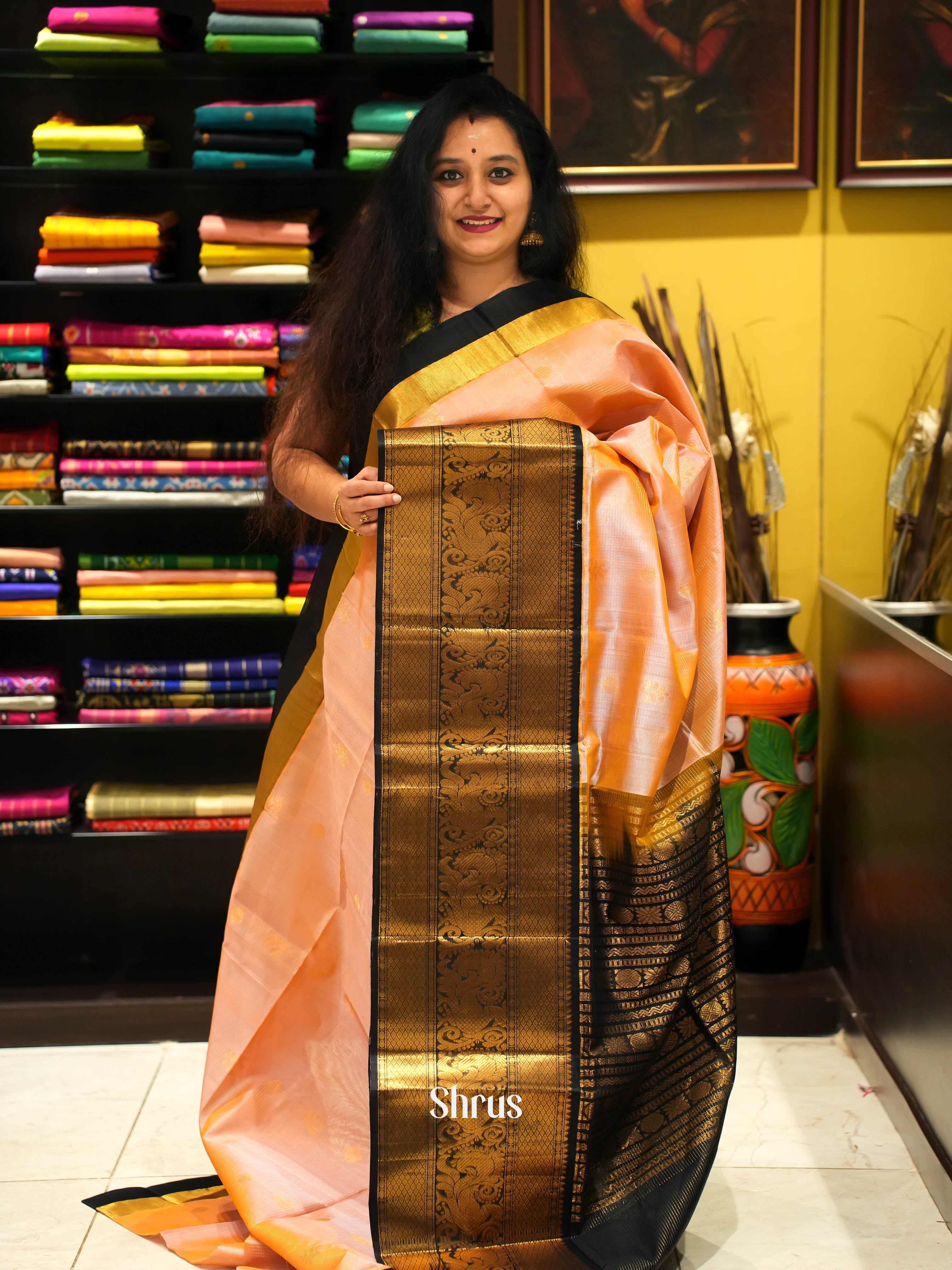 Elegant Peach Silk Cotton Saree With Zari Woven Floral Buttas And Contrast Black Zari Woven Border With Beautiful Peacock Motifs - Shop on Shrus.com