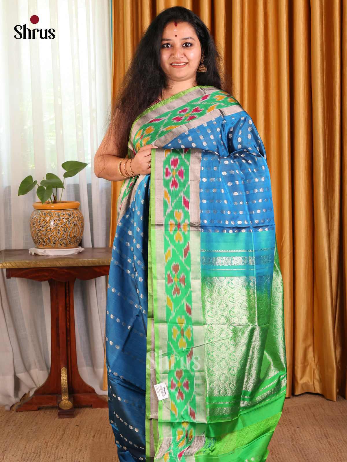 Vibrant Blue Uppada silk Saree with thousand buttas & contrast pochampally border