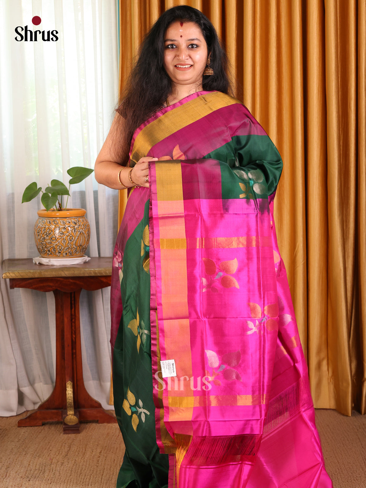 Classy Bottle green Uppada silk Saree with gold & silver zari floral motifs