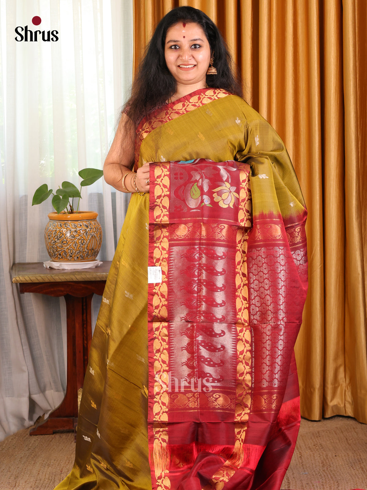 Elegant Mehandi Green Uppada silk Saree with gold, silver zari buttas & floral vines border