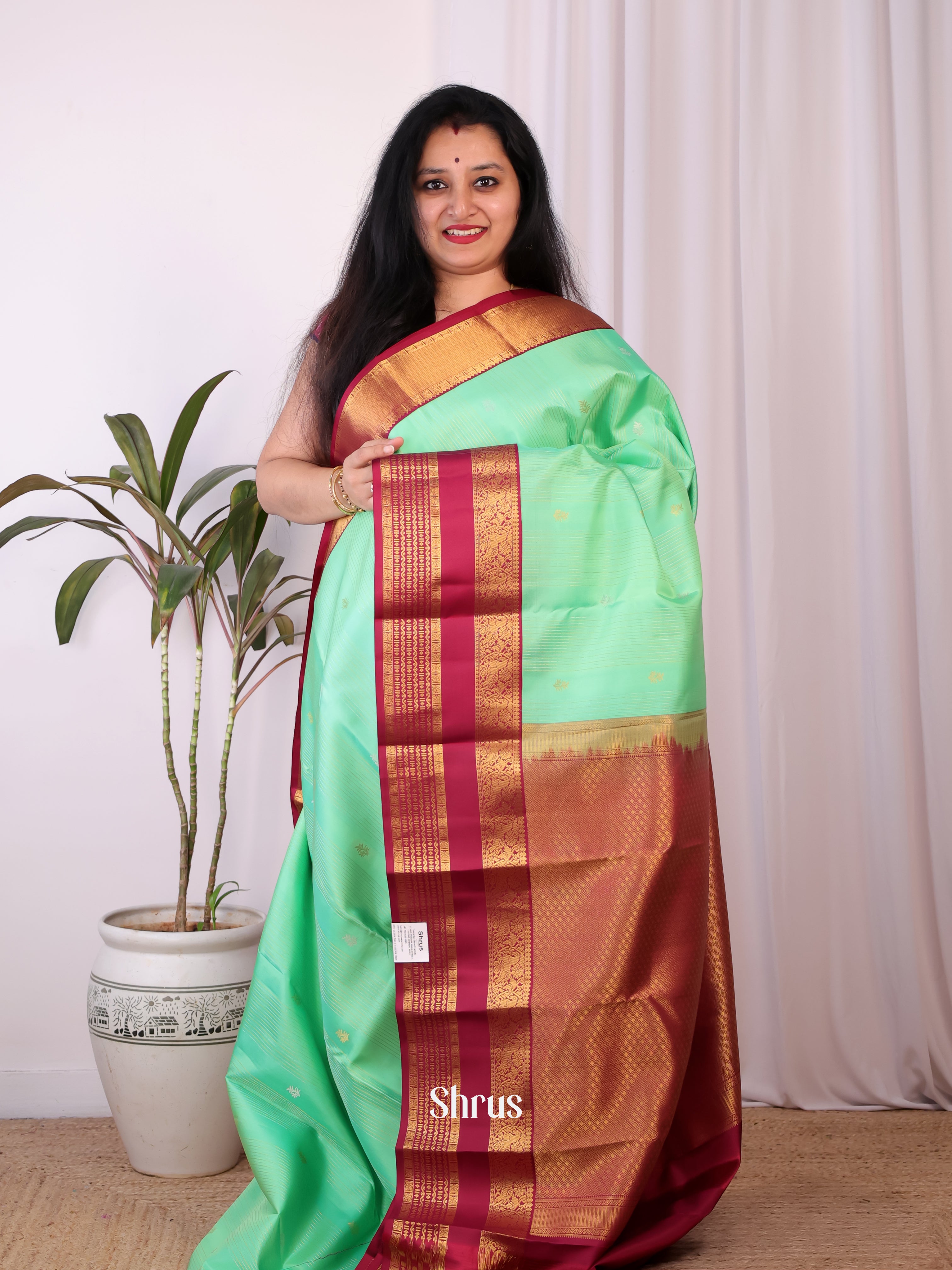 Contemporary Green and Maroon Kanchipuram silk Saree With Zari Woven Floral Buttas-1