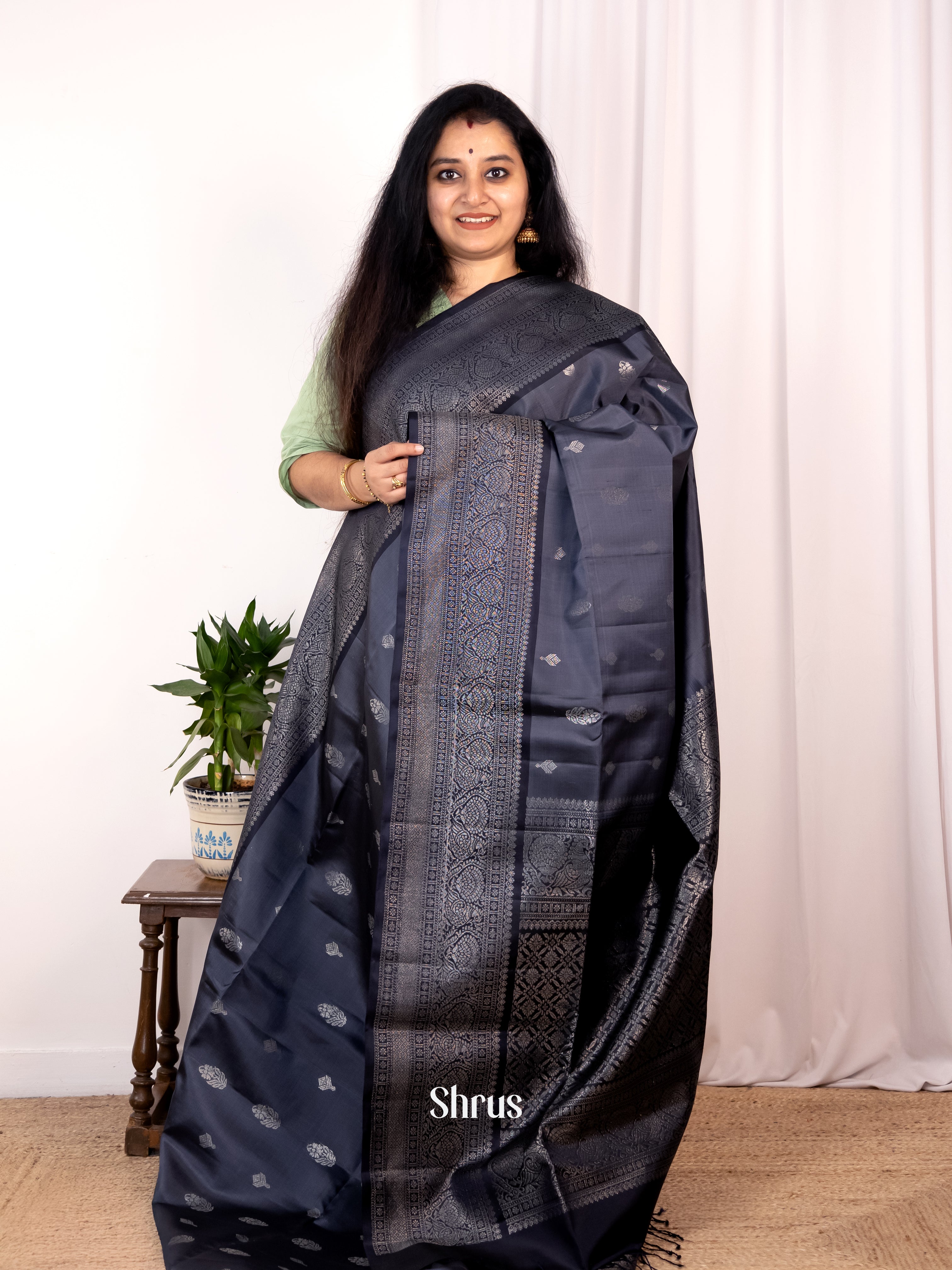Alluring Black Soft Silk Saree with Zari Floral Buttas, Gold Zari Border & Brocade Pallu - Shop on Shrus.com