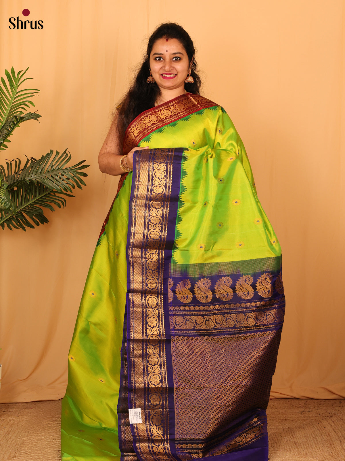 Vibrant Parrot Green Gadwal Silk Saree with Floral Biuttas & Ganga Jamuna Border
