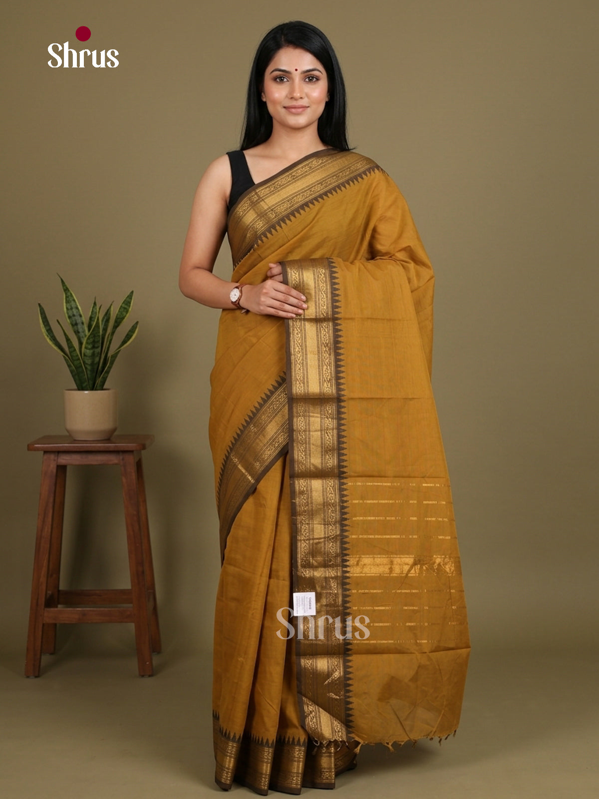 Charming Deep Mustard Chettinad Cotton Saree With Plain Body & Brown Zari Temple Border
