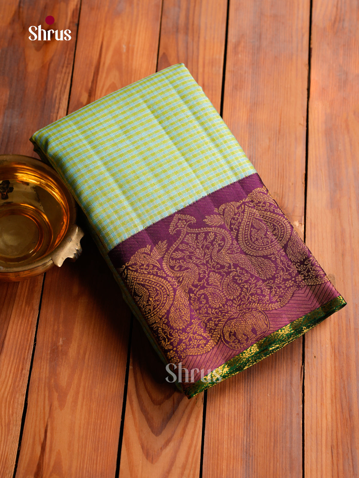 Chic Sea Green Kanchipuram Saree With Intricate Checks Patterns & Purple Border With Paisley Motifs