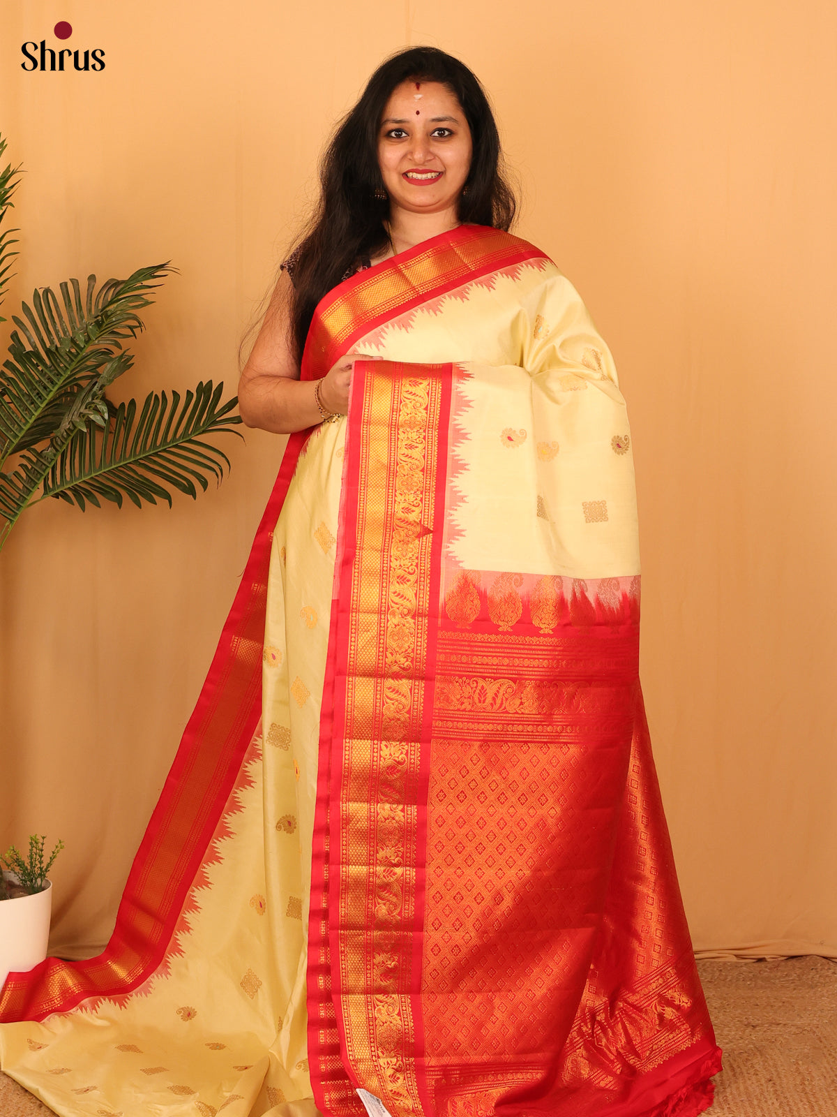 Luminous Light Yellow Gadwal Silk Saree with Red Zari Woven Border