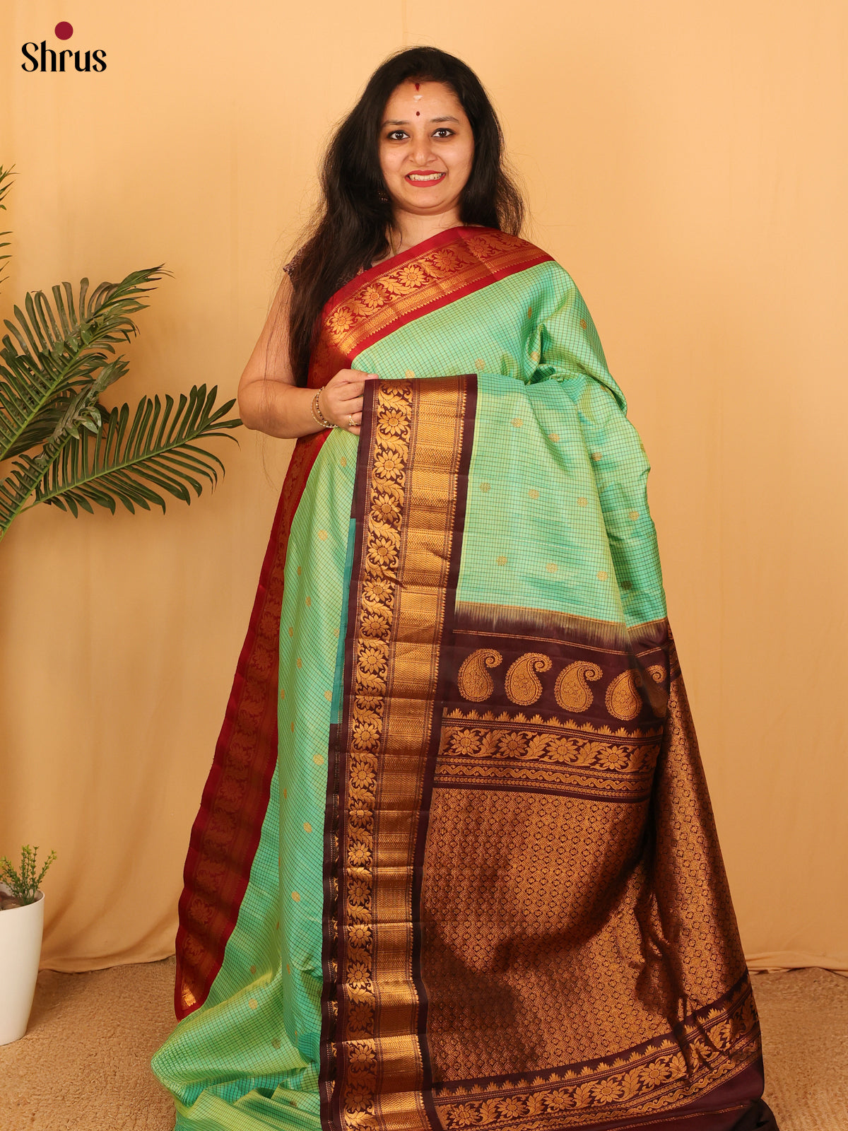 Versatile Teal Green Gadwal Silk Saree with Ganga Jamuna Border