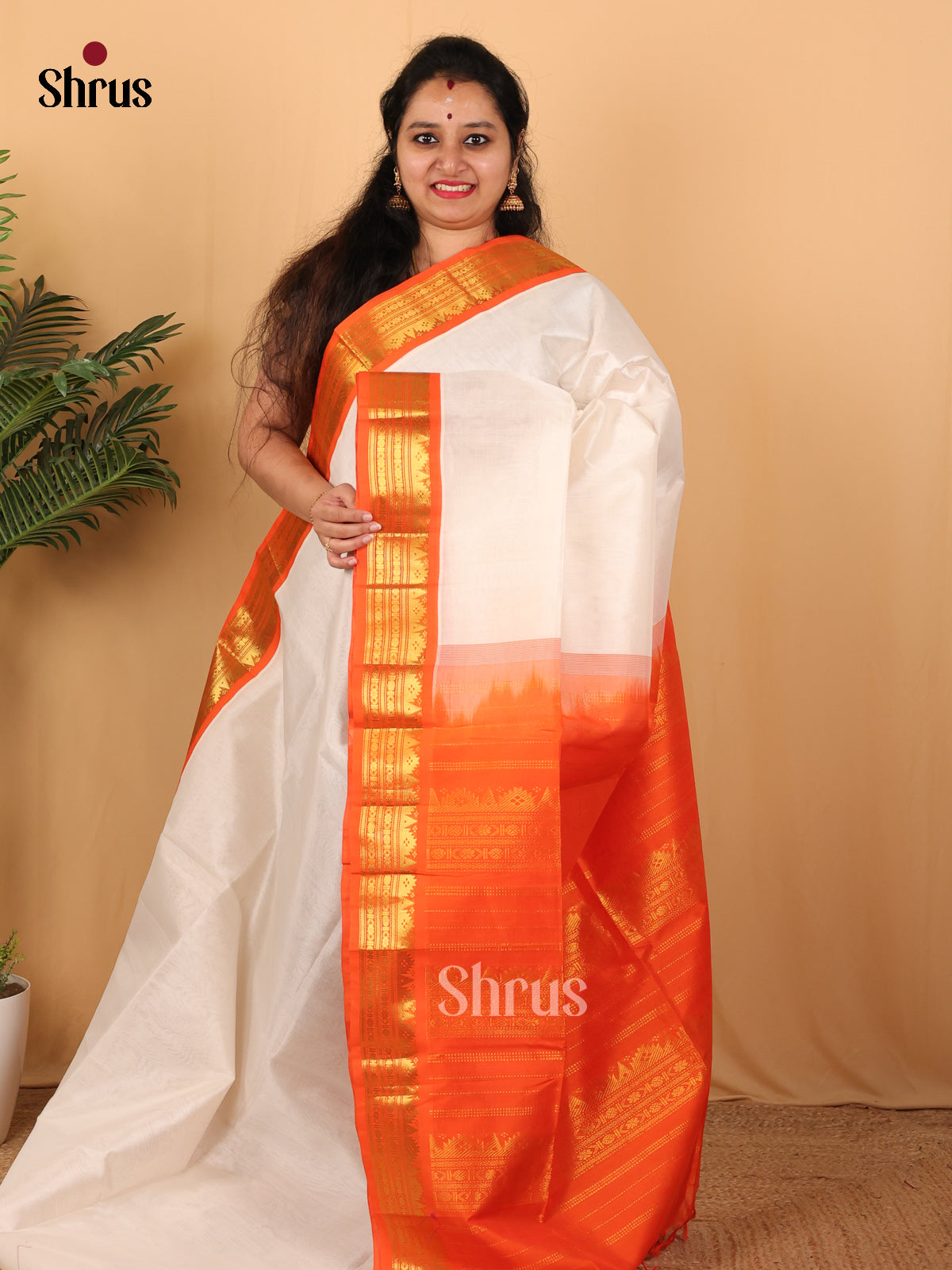 Classic Cream Silk Cotton Saree With Plain Body And Contrast Orange Zari Woven Border - Shop on Shrus.com