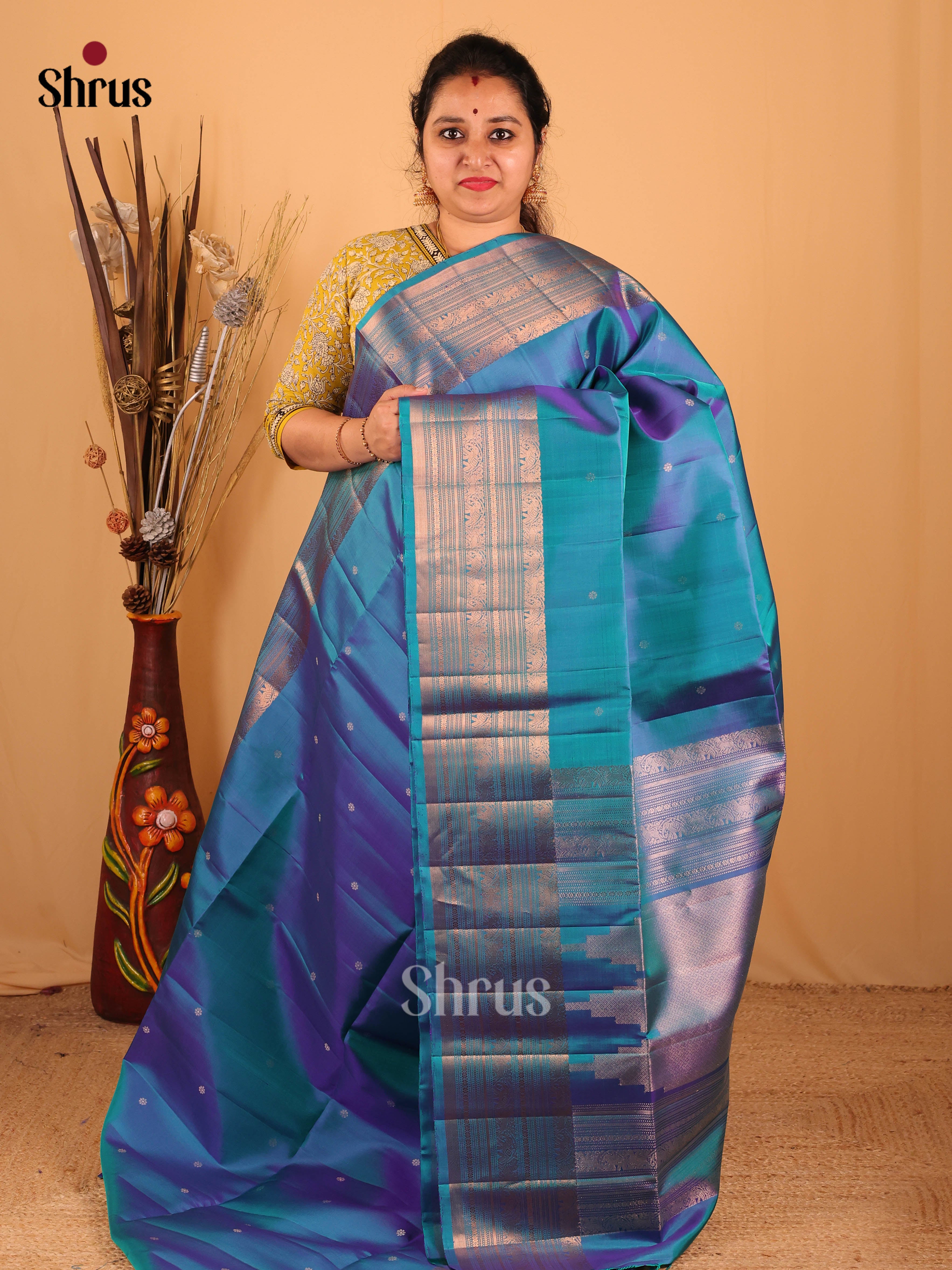 Dazzling Peacock Blue Soft Silk Saree With Floral Zari Buttas, Self Border & Brocade Pallu - Shop on Shrus.com