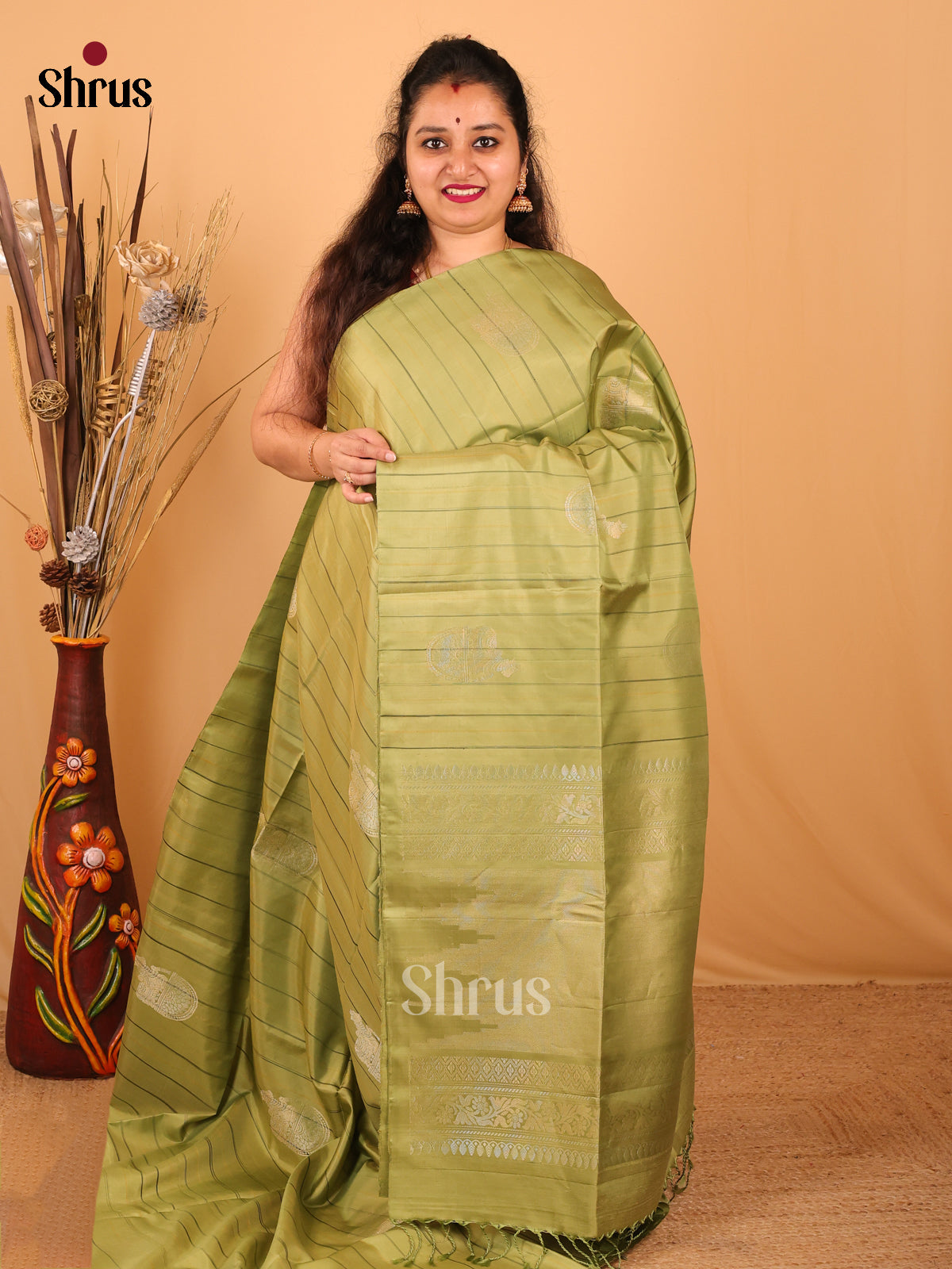 Luminous Olive Green Zari Cow Motifs Soft Silk Saree with Chic Stripes & Brocade Pallu-1