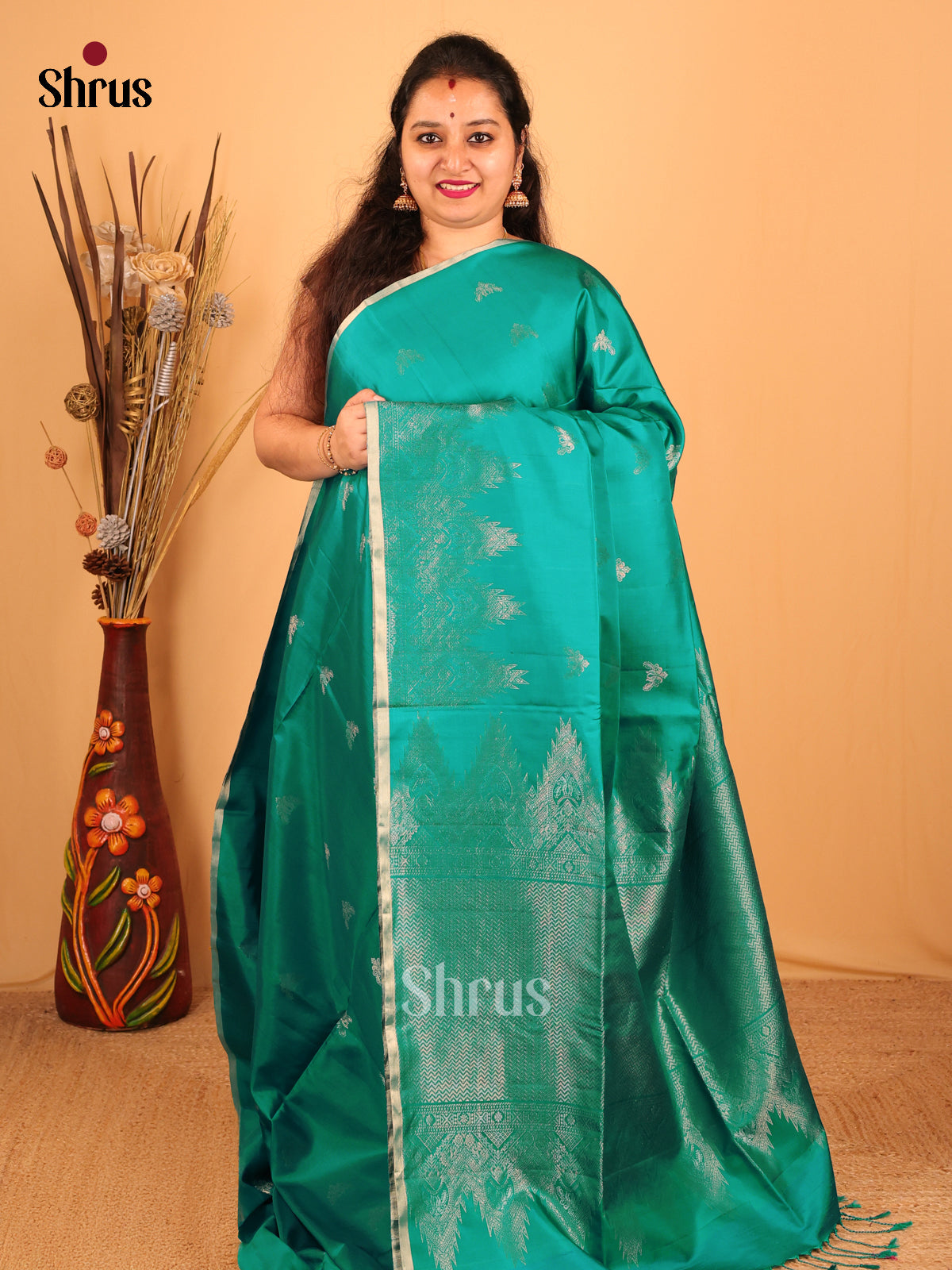 Elegant Green Soft Silk Saree with Zari Buttas, Self Border & Pallu-1
