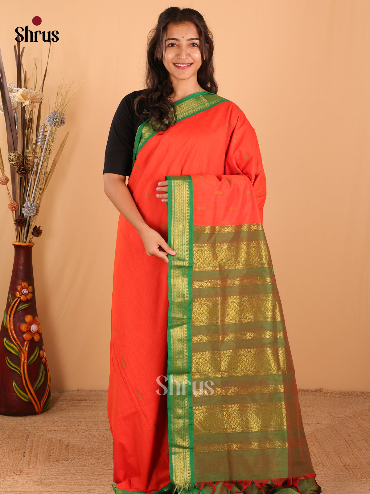 Vibrant Reddish Orange Kalyani Cotton Saree, paired with Green Border & Pallu - Shop on Shrus.com