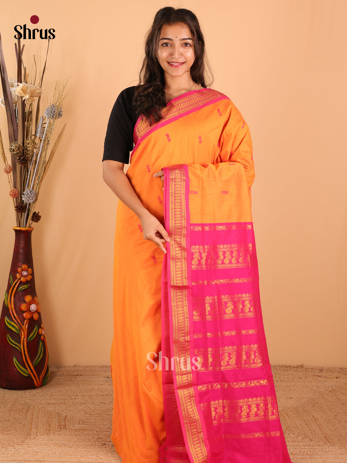 Lite Orange Kalyani Cotton Saree With Buttas, accented by a Bold Dark Pink Border & Pallu - Shop on Shrus.com