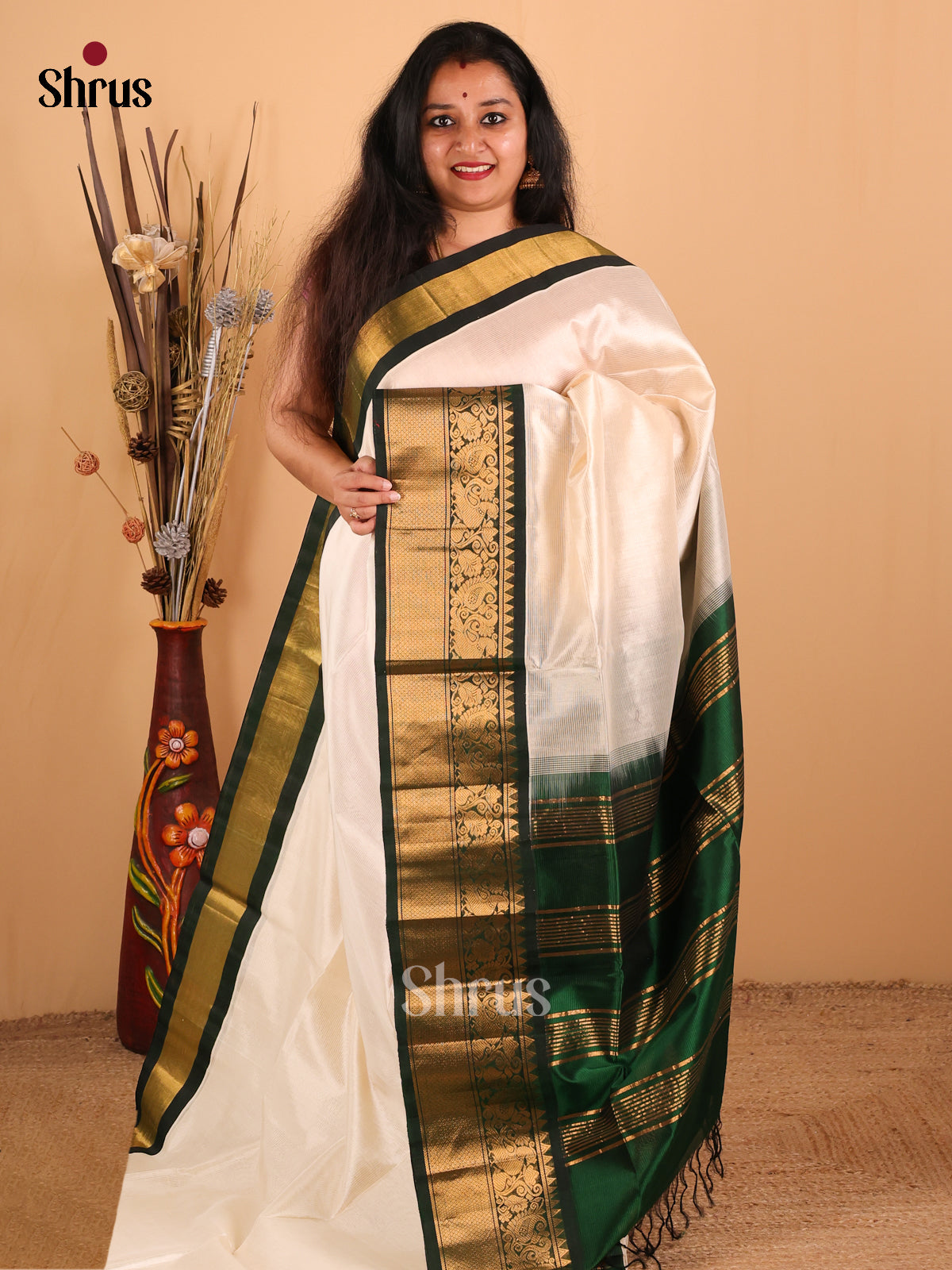 Chic Off White And Green Silk Cotton Saree With Zari Woven Stripes Across The Body And Beautiful Peacock Motifs in The Border - Shop on Shrus.com