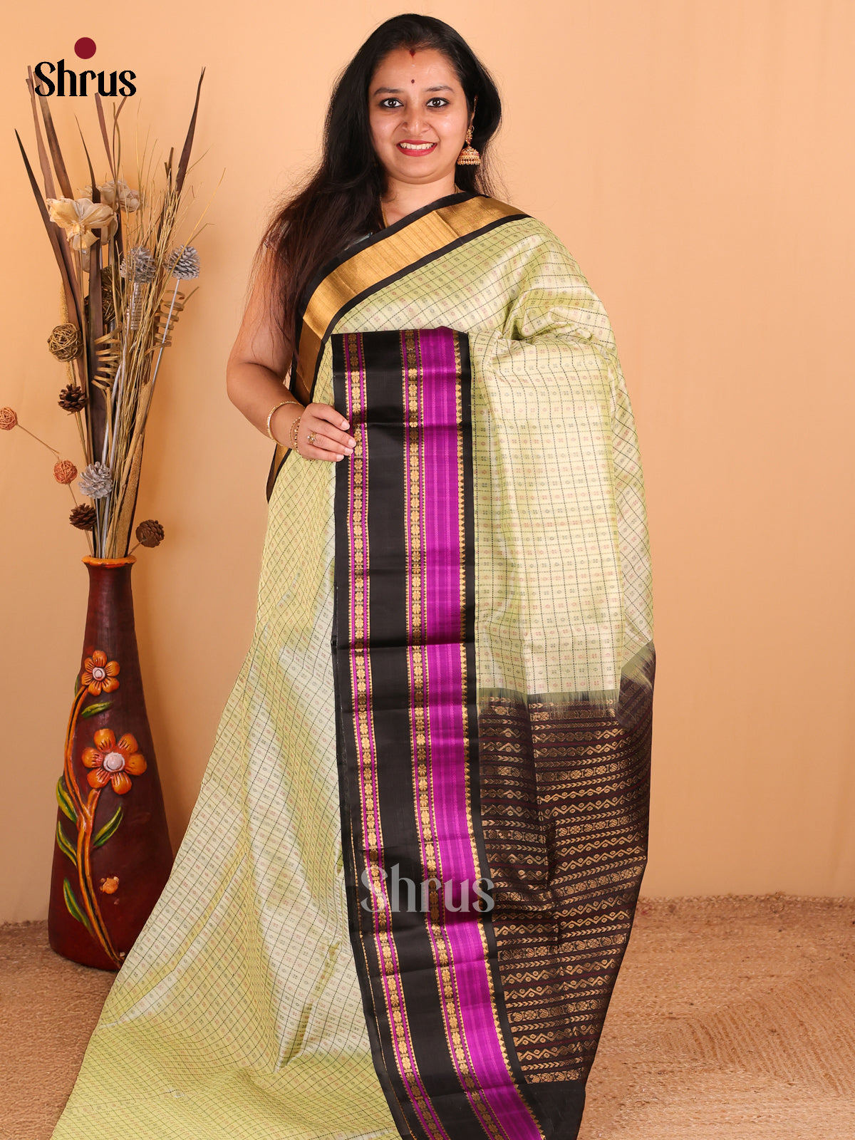 Cream Silk Cotton Saree with Checks & Buttas Paired With Black & Magenta Zari Border