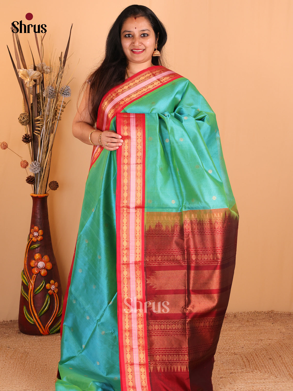 Enchanting Green Silk Cotton Saree with Zari Buttas,Rettapet Border & Red Zari Pallu