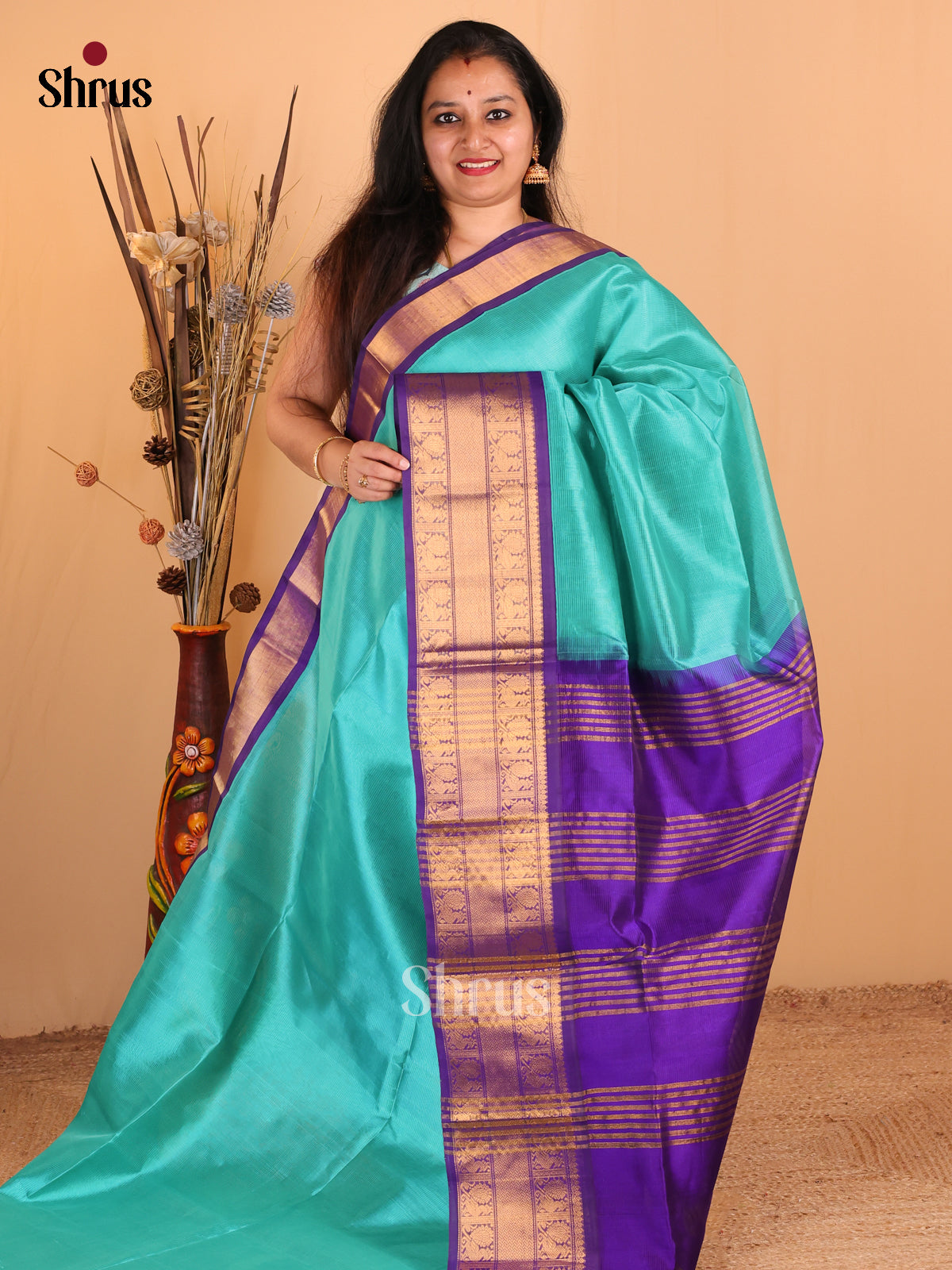 Lustrous Teal Silk Cotton Saree with Plain Body Paired With Purple Border & Zari Pallu - Shop on Shrus.com