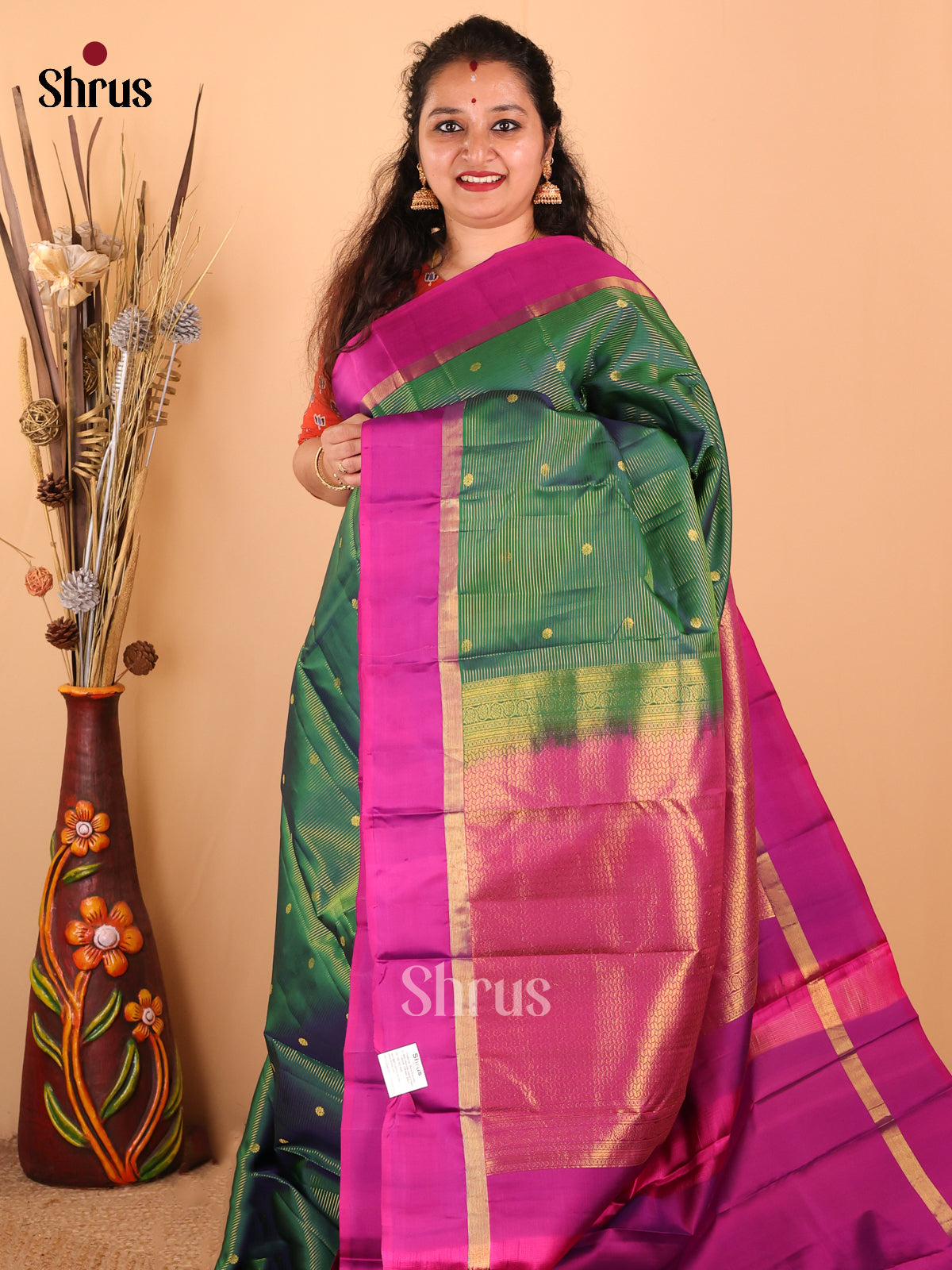 Glimmering Green Kanchipuram silk Saree with zari buttas & vaira oosi checks-1