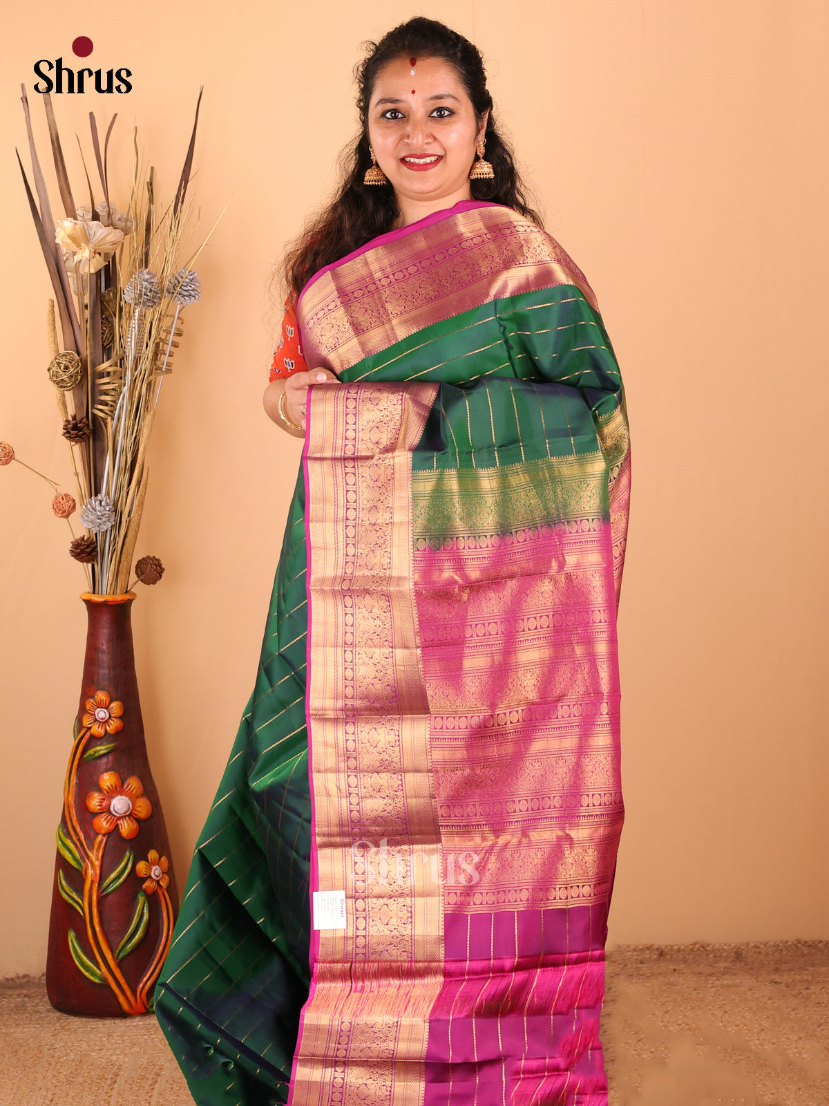 Classy Bottle Green Kanchipuram silk Saree with zari stripes, floral vine border - Shop on Shrus.com