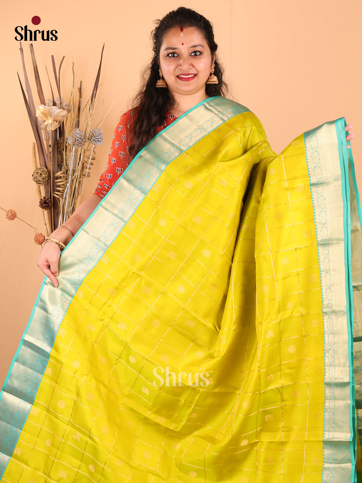 Graceful Mustardy Green Kanchipuram silk Saree with zari checks, criss cross brocade pallu - Shop on Shrus.com