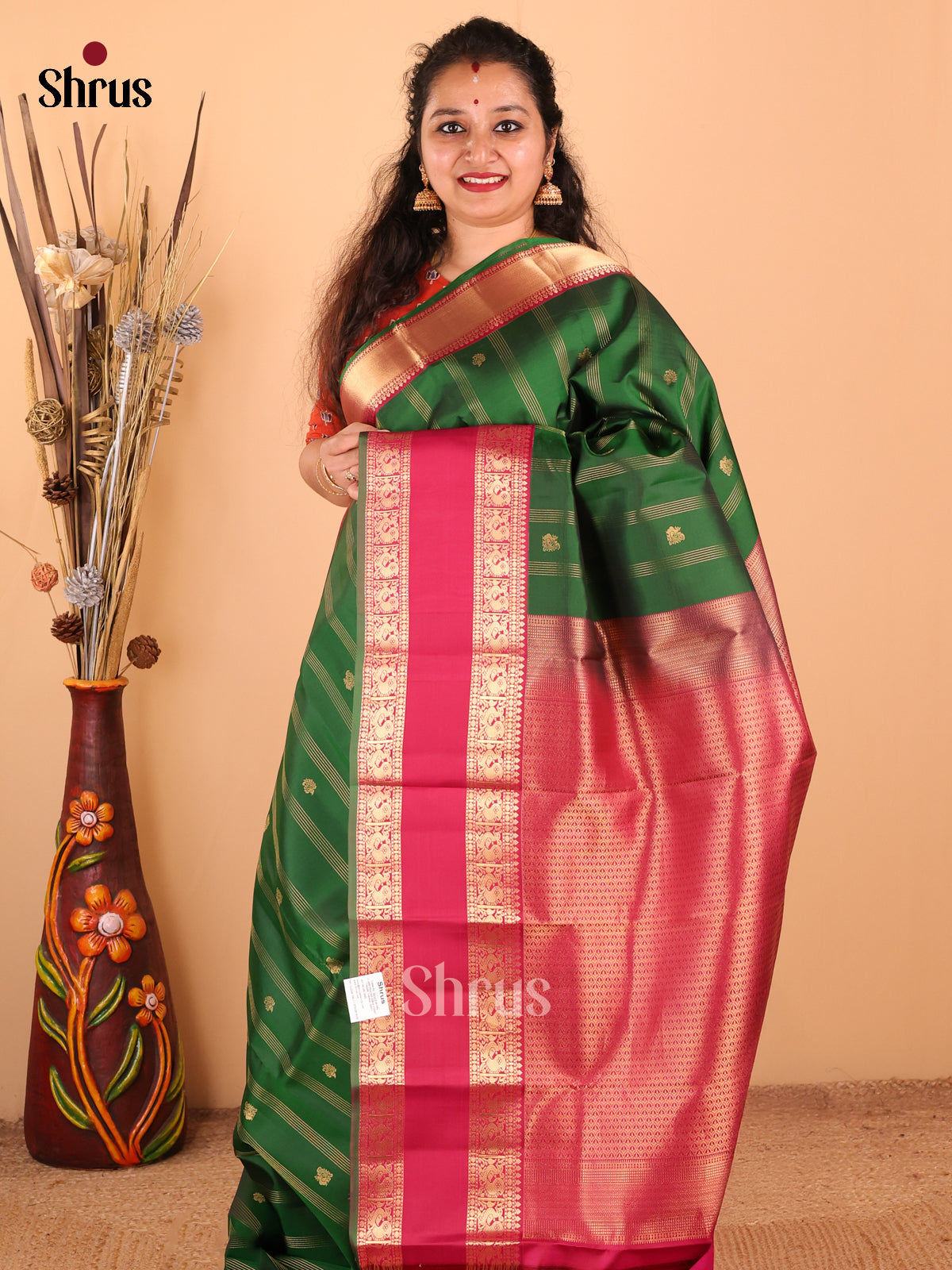 Exquisite Green Kanchipuram silk Saree with zari stripes, buttas , brocade pallu - Shop on Shrus.com