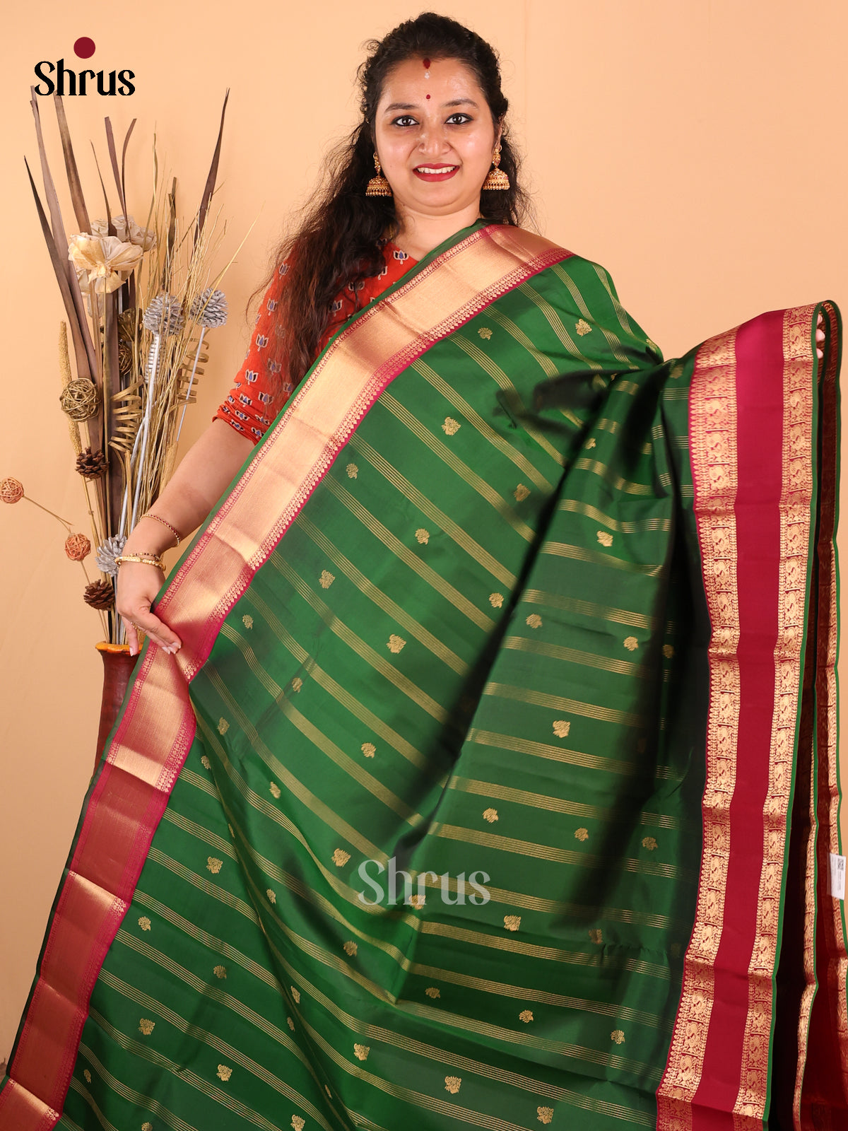 Exquisite Green Kanchipuram silk Saree with zari stripes, buttas , brocade pallu - Shop on Shrus.com