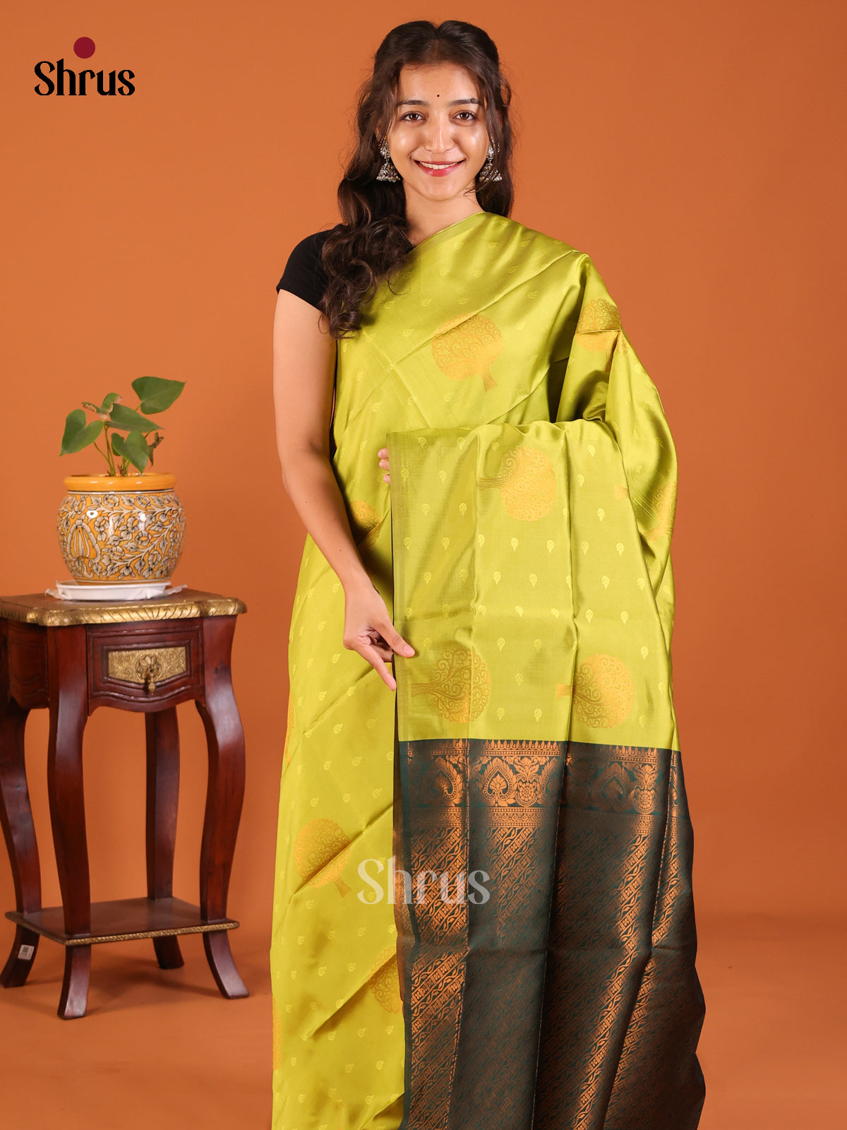 Graceful Lite Green Semisoft silk Saree with jacquard buttas, zari tree motifs ,green brocade pallu - Shop on Shrus.com