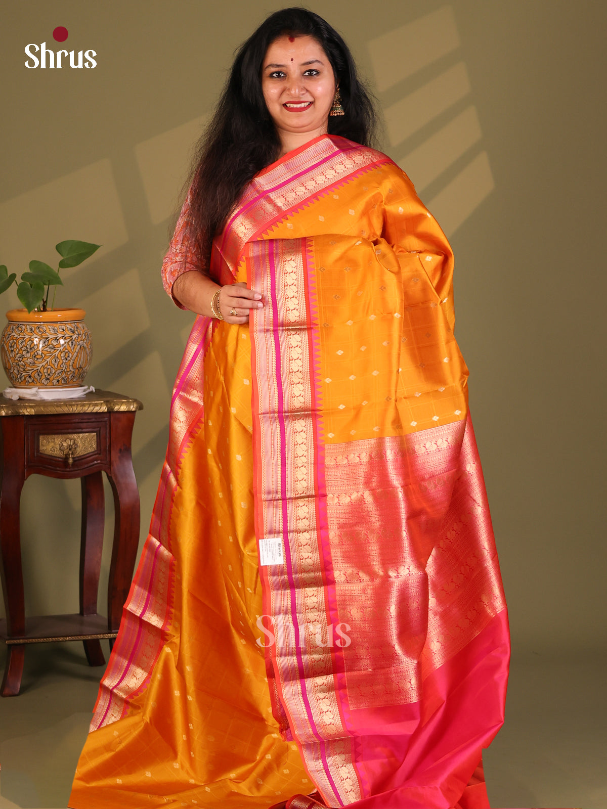 Luminous Mustard Kanchipuram Silk Saree gleams with zari buttas, peacock butta border-1