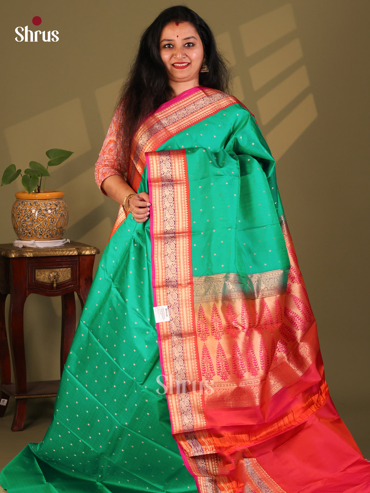 Exquisite Green Kanchipuram Silk Saree with zari buttas, floral vines border - Shop on Shrus.com
