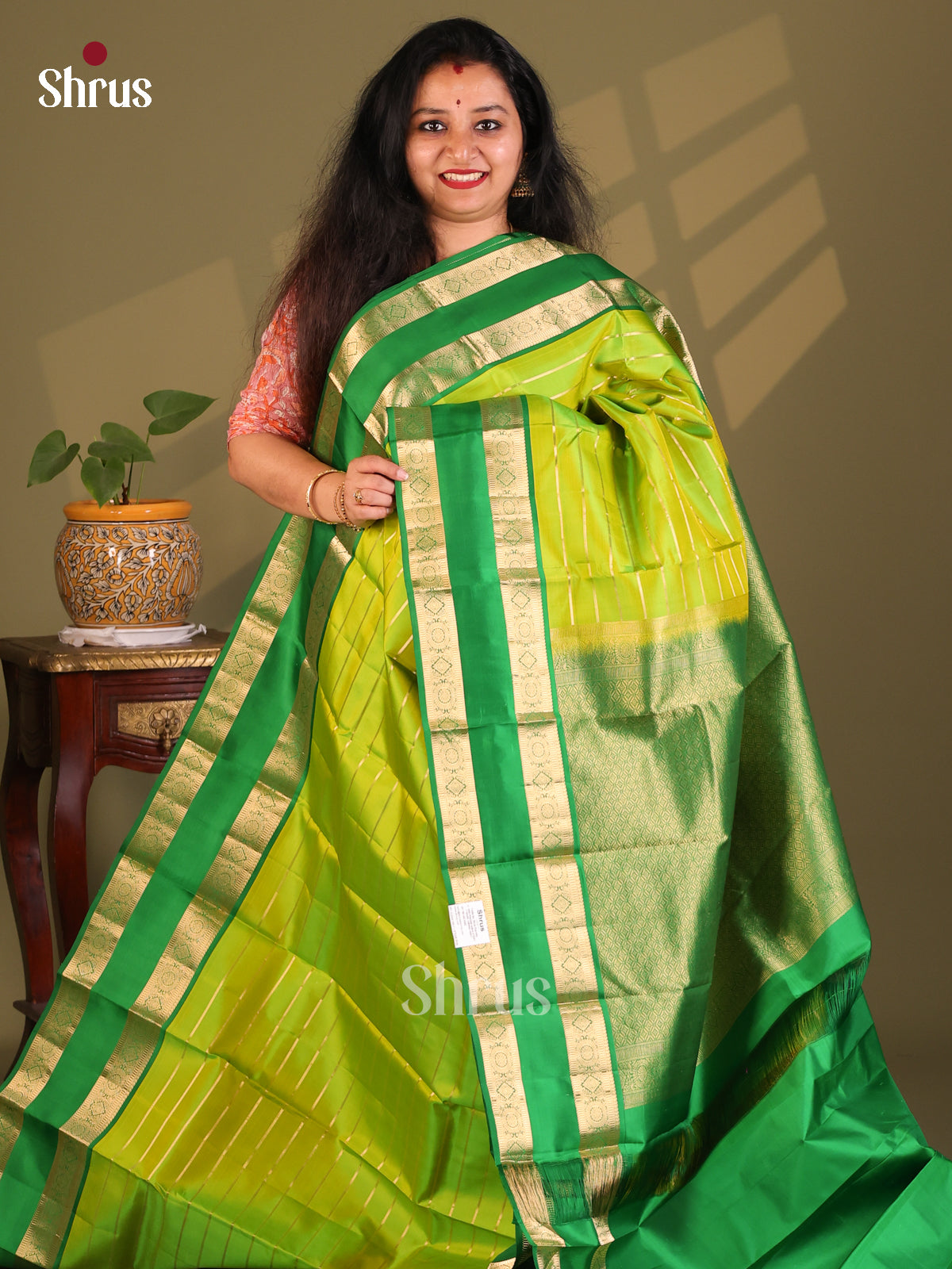 Elegant Parrot Green Kanchipuram Silk Saree with zari stripes & Rettaipet Border - Shop on Shrus.com