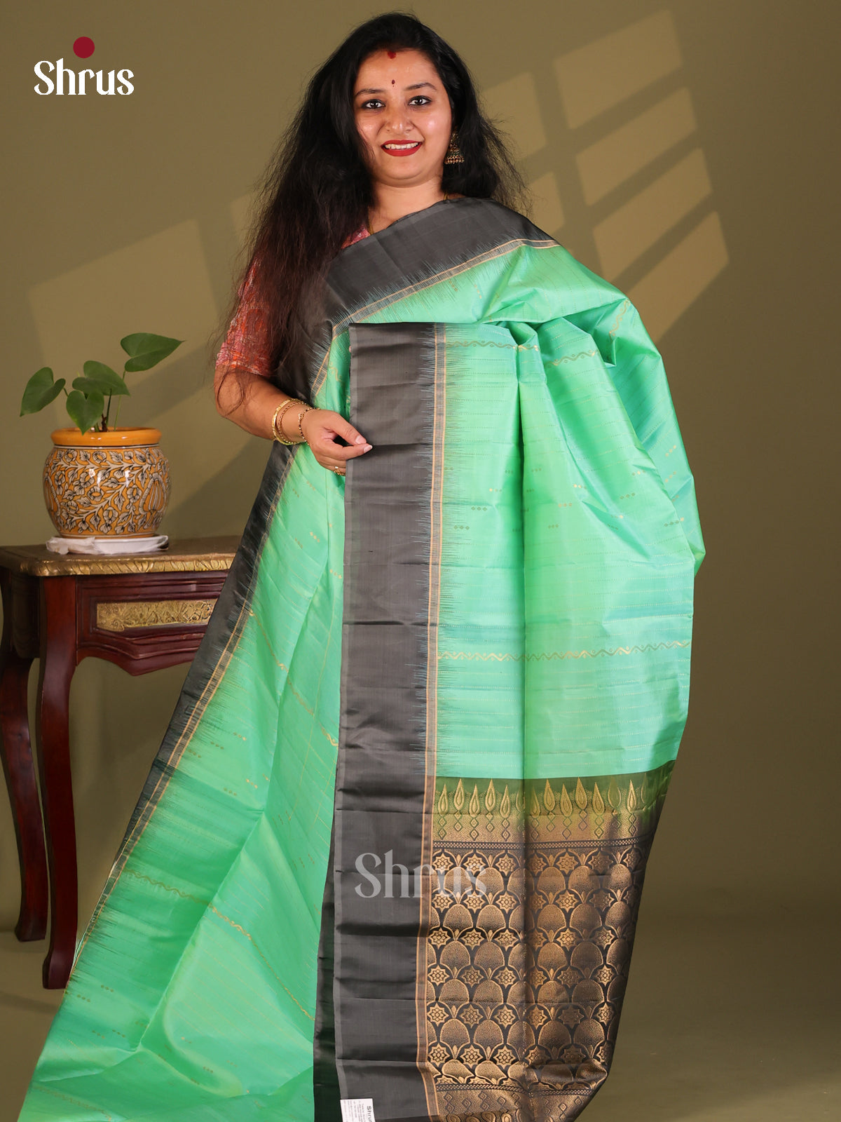 Regal Sea Green Soft Silk Saree with zari stripes pattern & brocade black pallu - Shop on Shrus.com