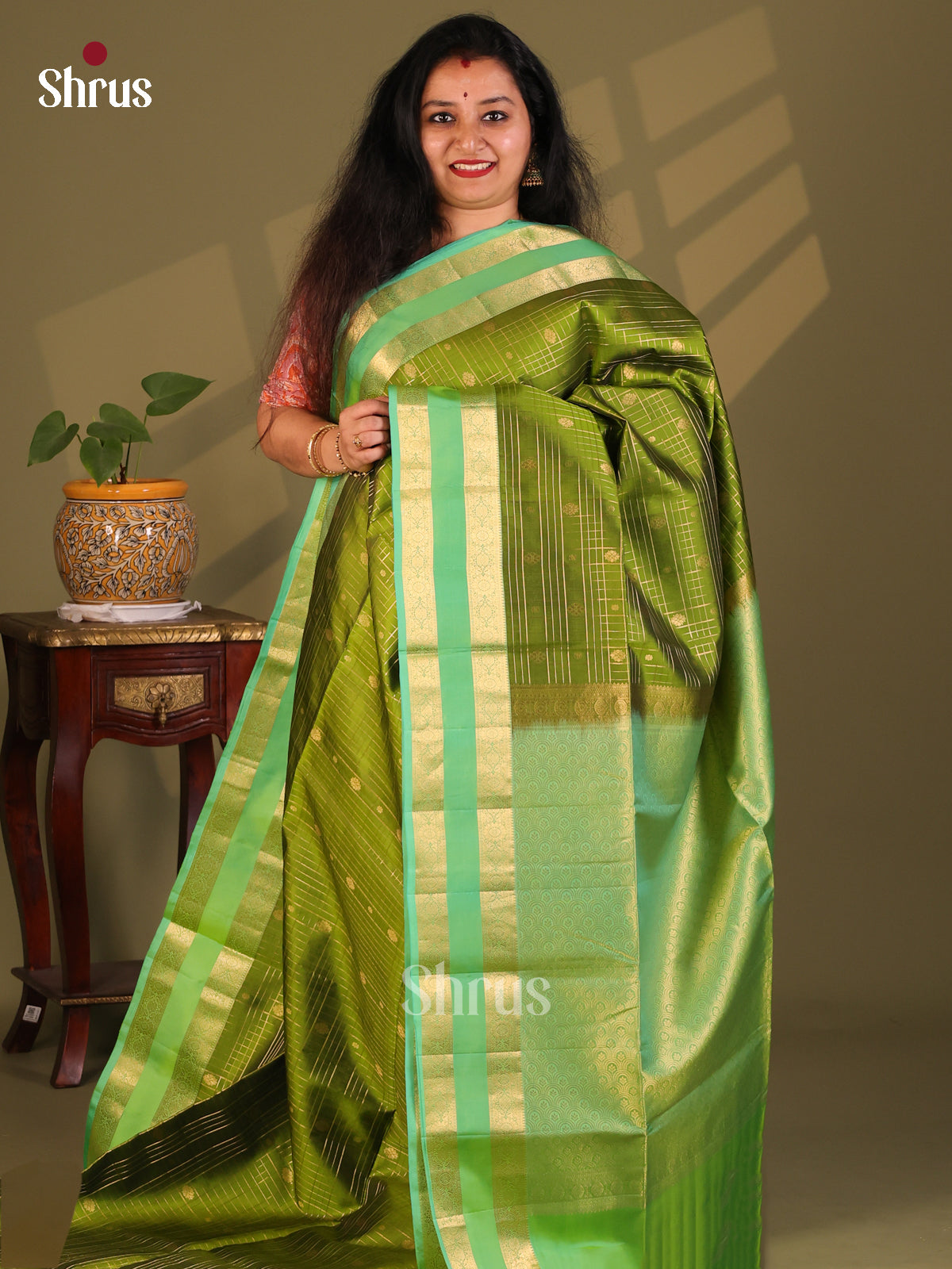 Charming Mehandi Green Soft Silk Saree with zari vaira oosi checks , buttas, contrast Rettaipet zari border - Shop on Shrus.com