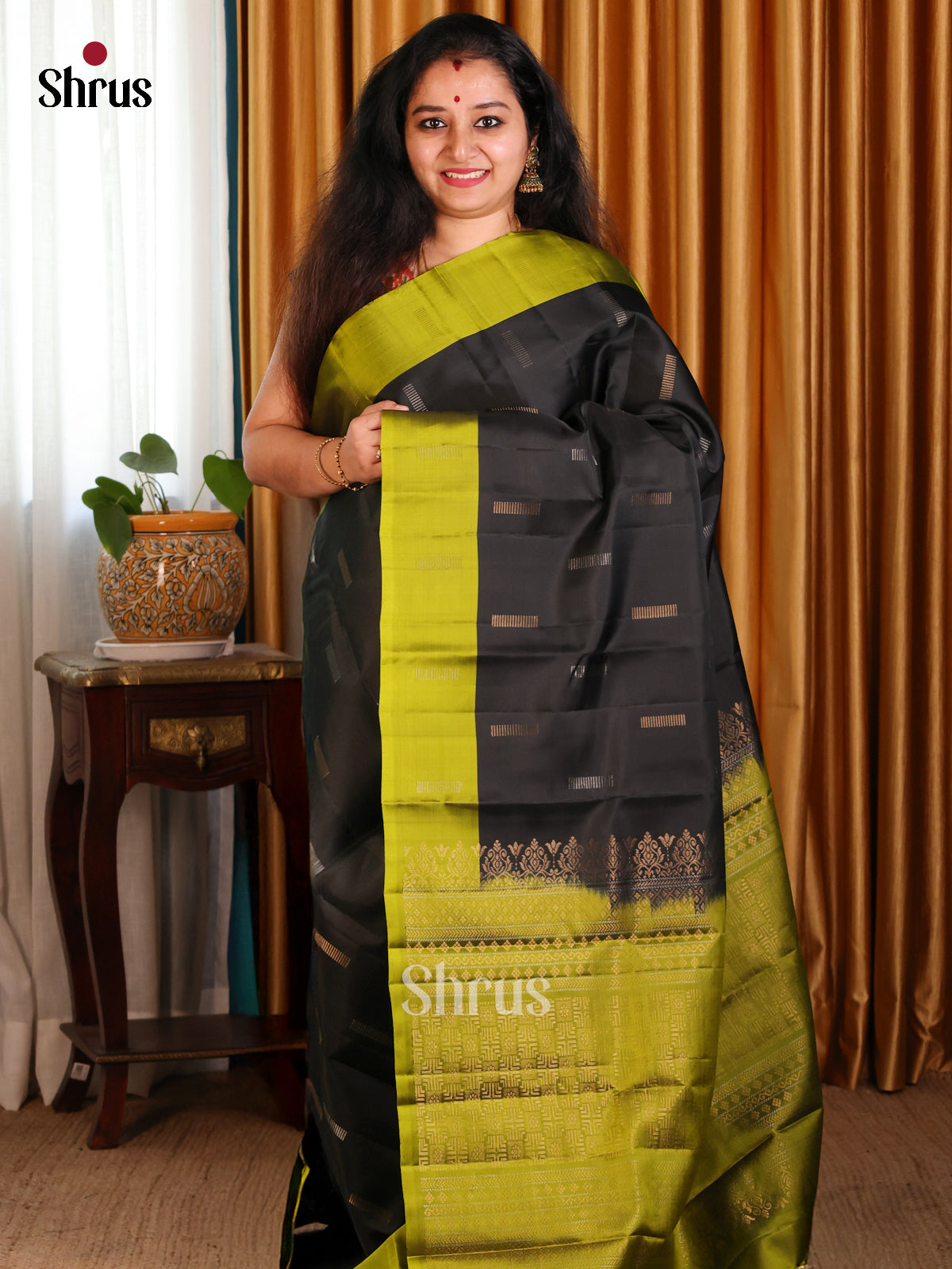 Charming Black Softsilk-halfpure Saree with zari buttas & green floral brocade pallu - Shop on Shrus.com