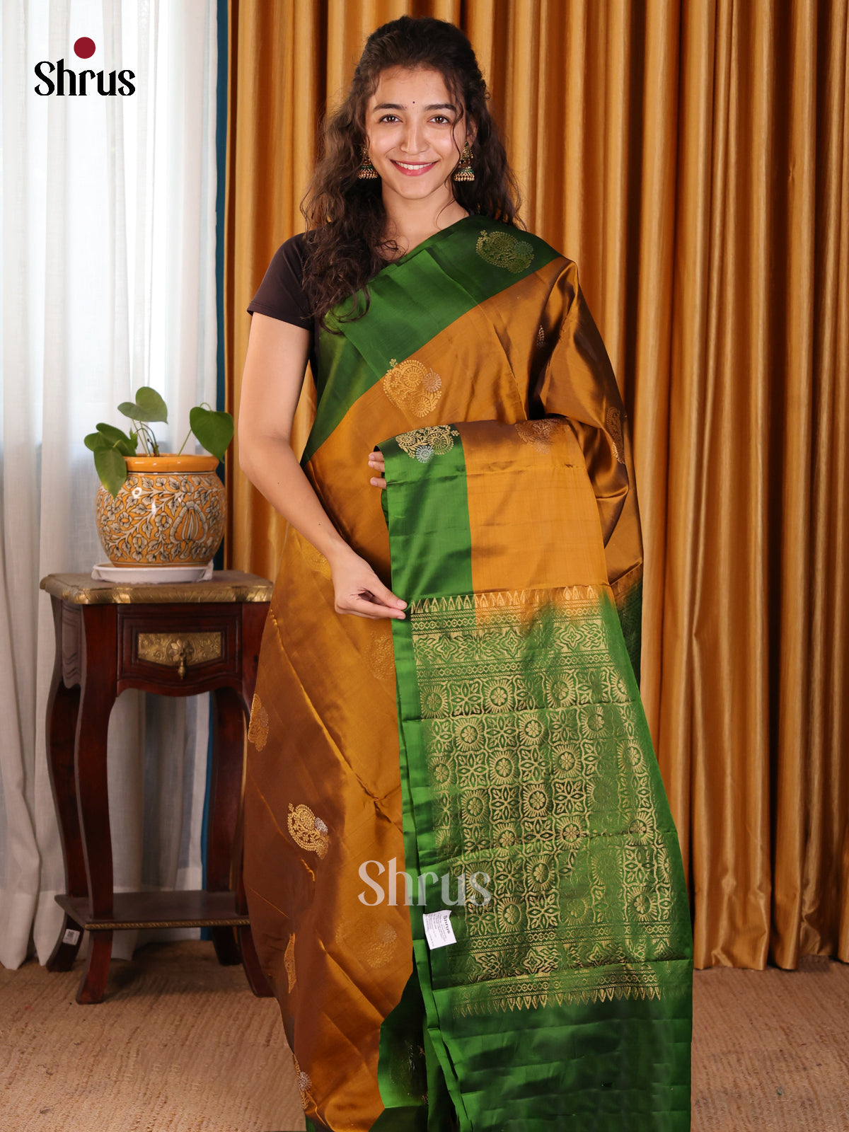 Lustrous Mustard Softsilk-halfpure Sareewith gold zari floral motifs, green border - Shop on Shrus.com