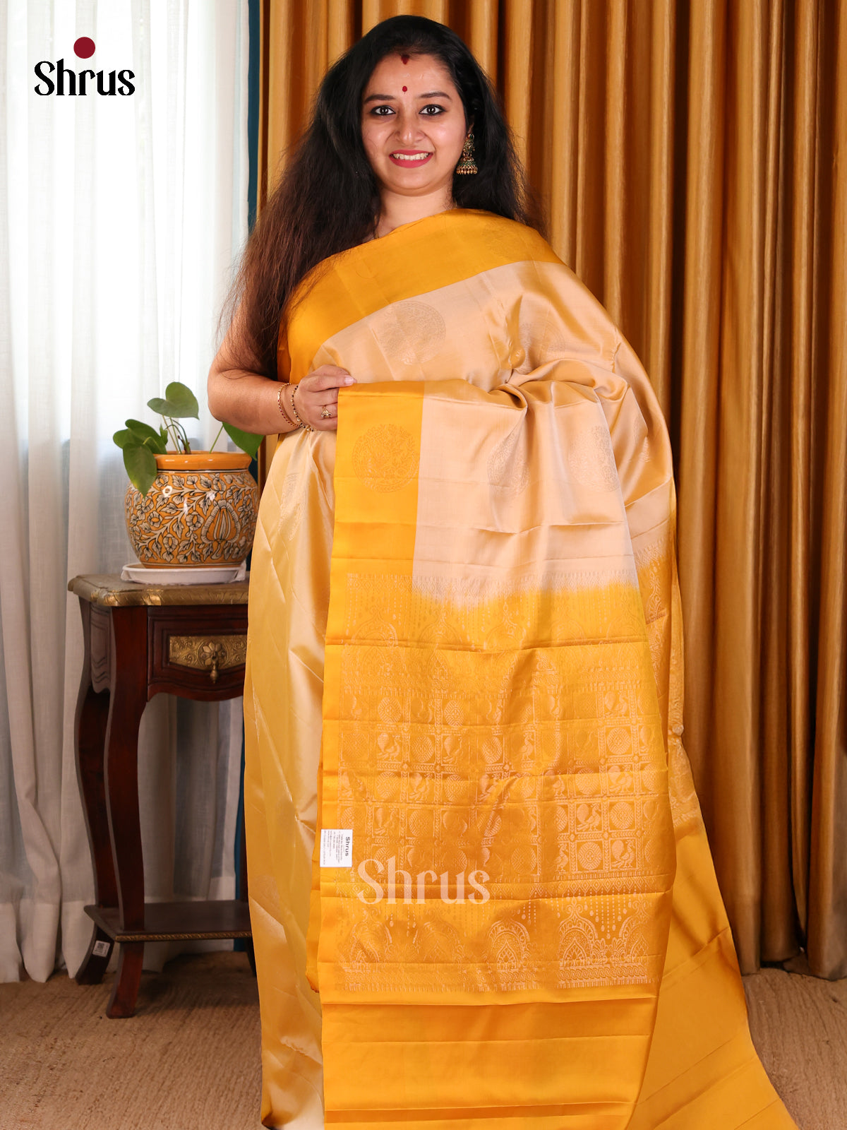 Glimmering Peach Softsilk-halfpure Saree with gold zari motifs & Mustard brocade pallu - Shop on Shrus.com
