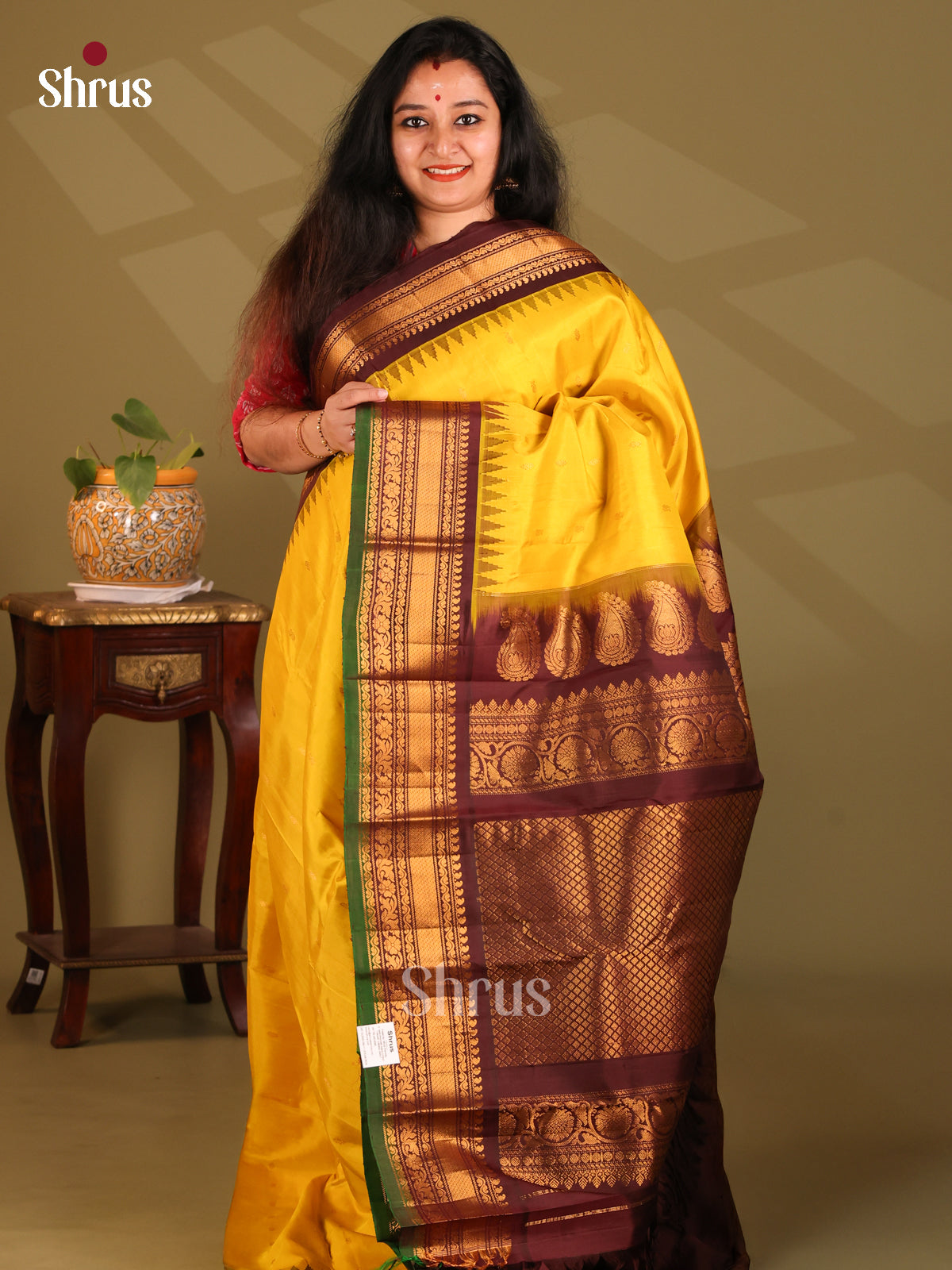 Lustrous Yellow Gadwal silk Saree With zari buttas & floral vine border