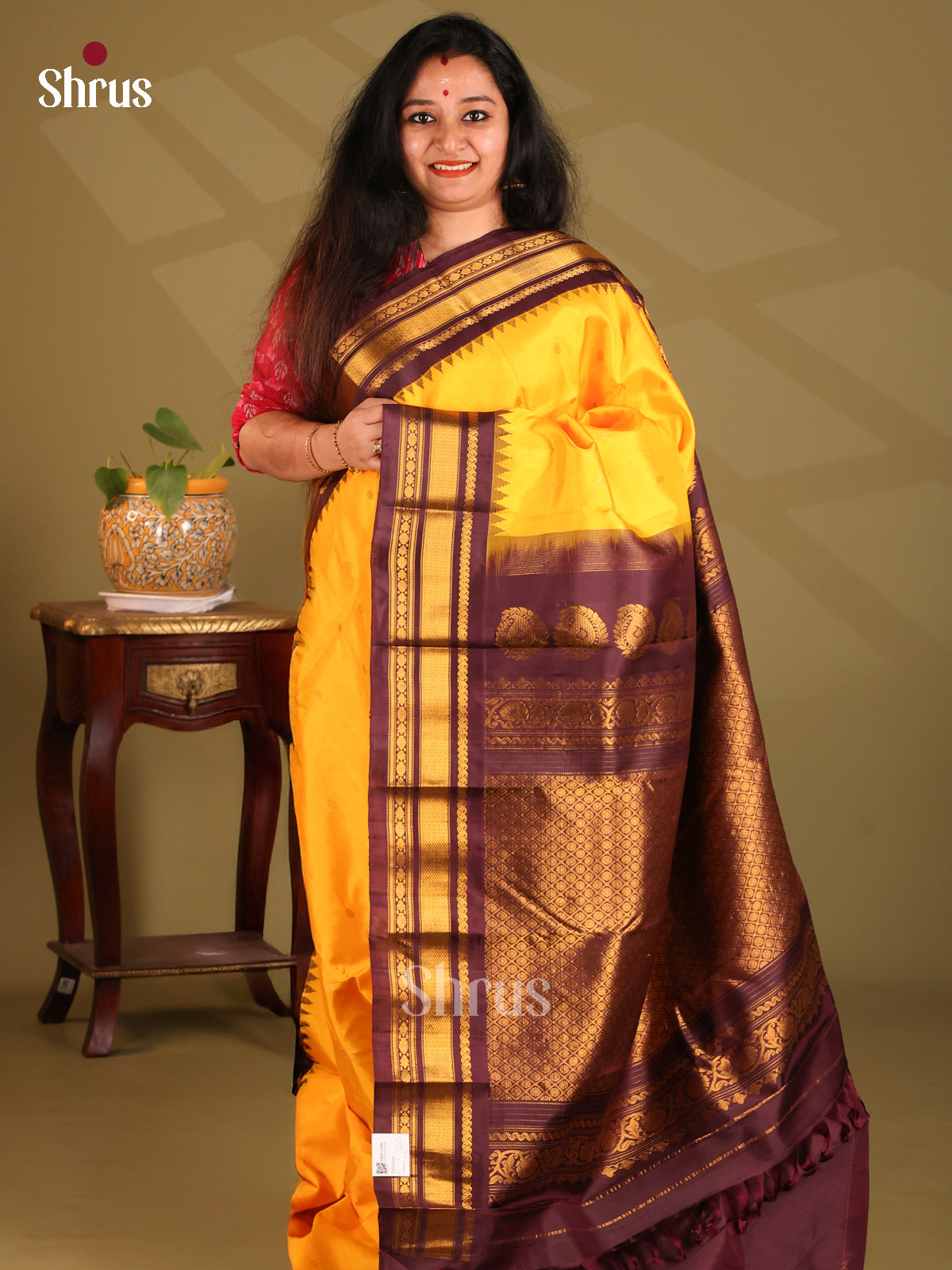 Glorious Yellow Gadwal silk Saree with gold zari buttas & brown zari border