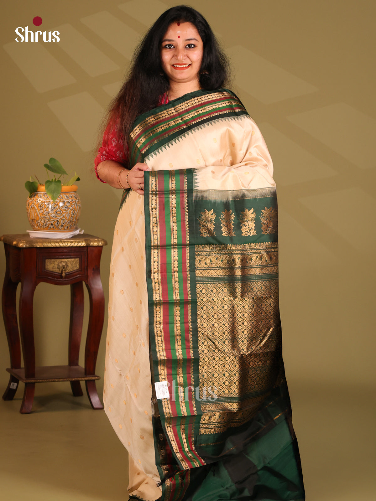 Exquisite Cream Gadwal silk Saree gleams with zari buttas , green zari border - Shop on Shrus.com