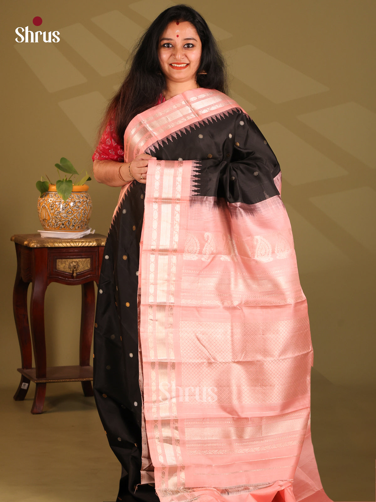 Lustrous Black Gadwal silk Saree with gold, silver zari buttas & contrast pink border