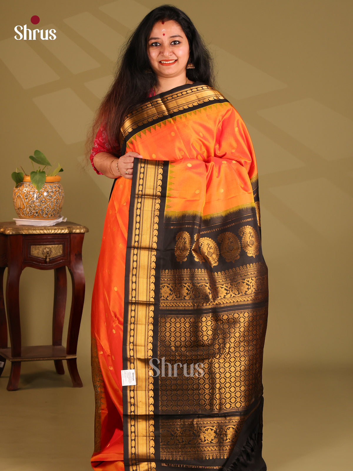 Radiant Orange Gadwal silk Saree with zari buttas & contrast black brocade pallu