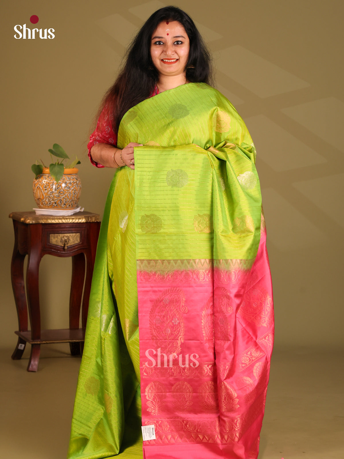 Sizzling Parrot Green Soft Silk Saree with zari stripes, contrast pink brocade pallu - Shop on Shrus.com