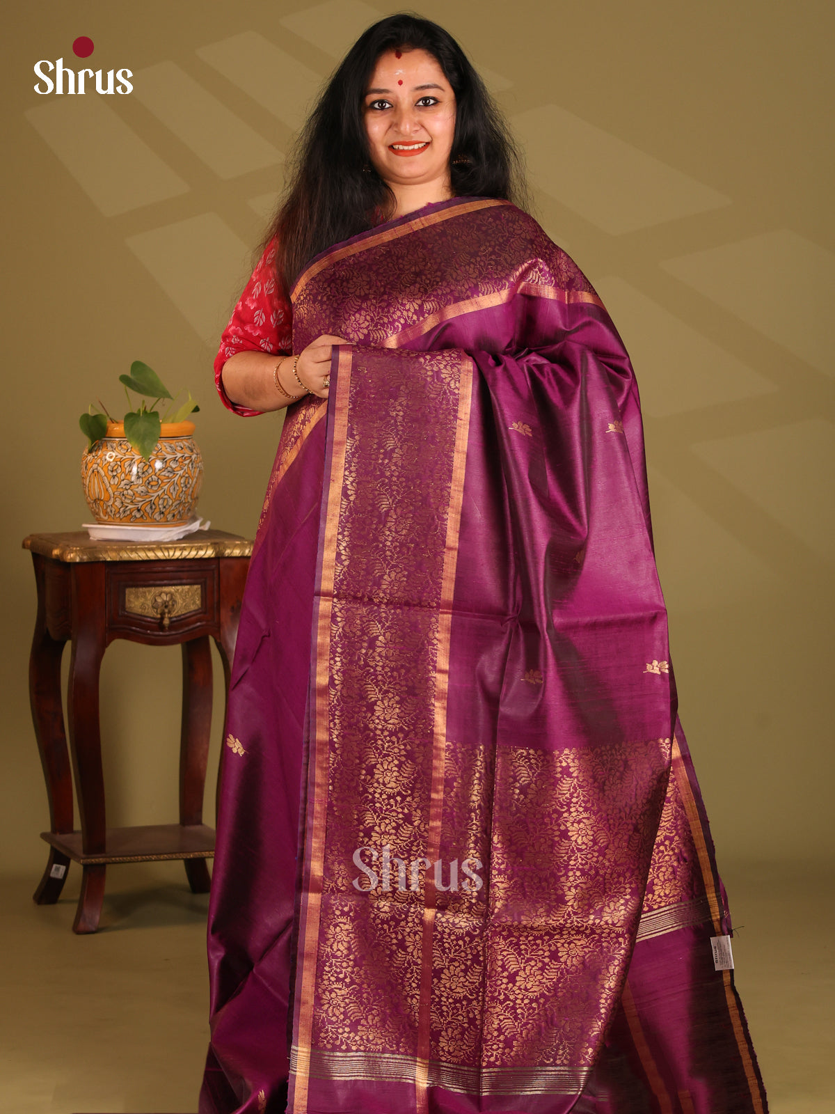 Pretty Purple Raw Silk Saree dazzles with gold zari floral buttas, self brocade border