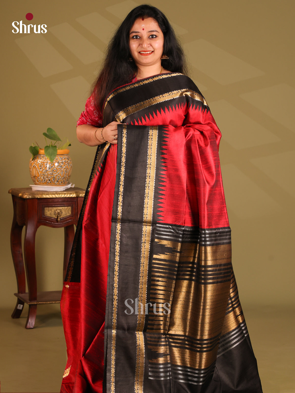 Bright Red Raw Silk Saree enchants with plain body , brown zari woven pallu