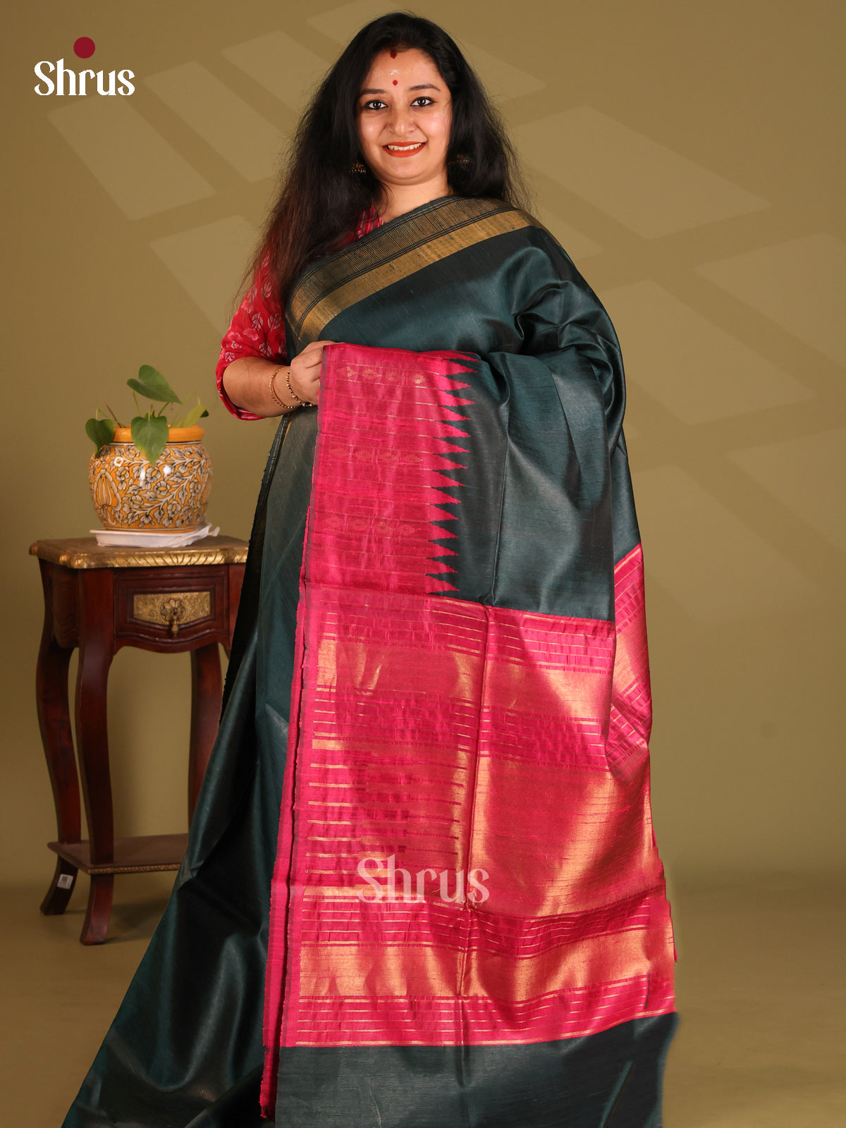 Pretty Dark Green Raw Silk Saree with plain body ,Maroon zari temple border