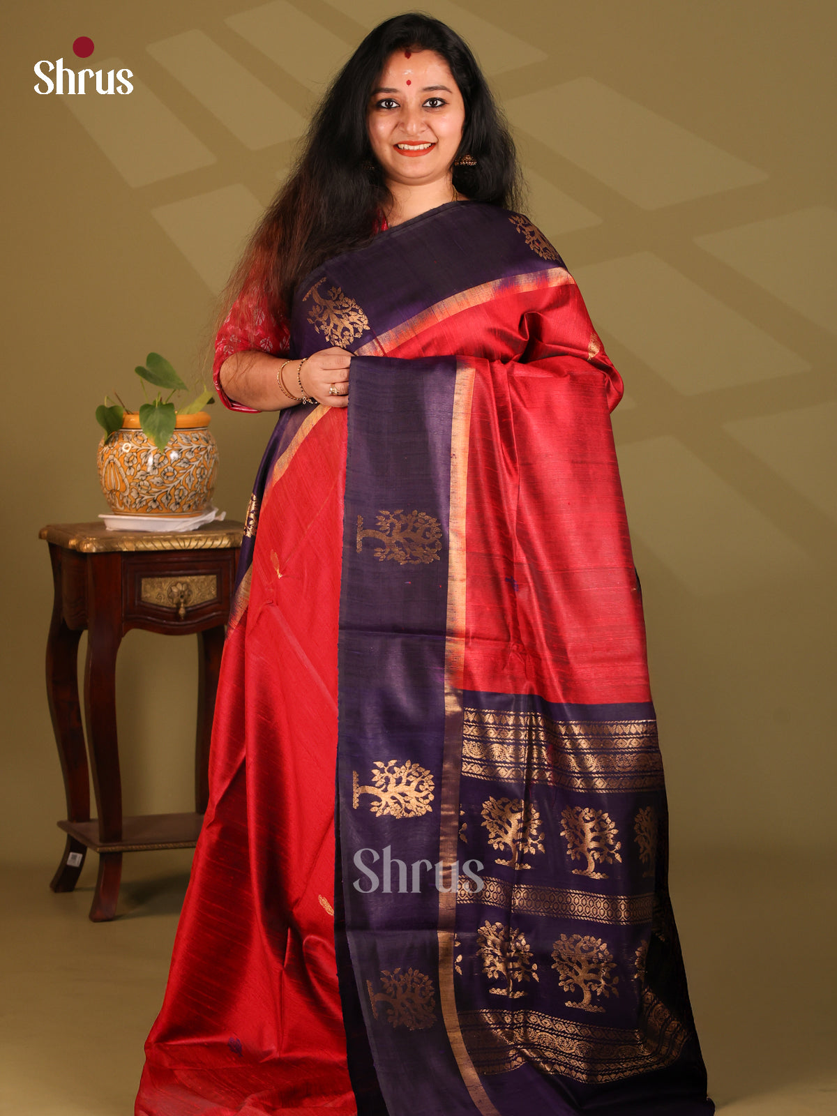Regal Red Raw Silk Saree with gold zari buttas , blue floral motifs pallu