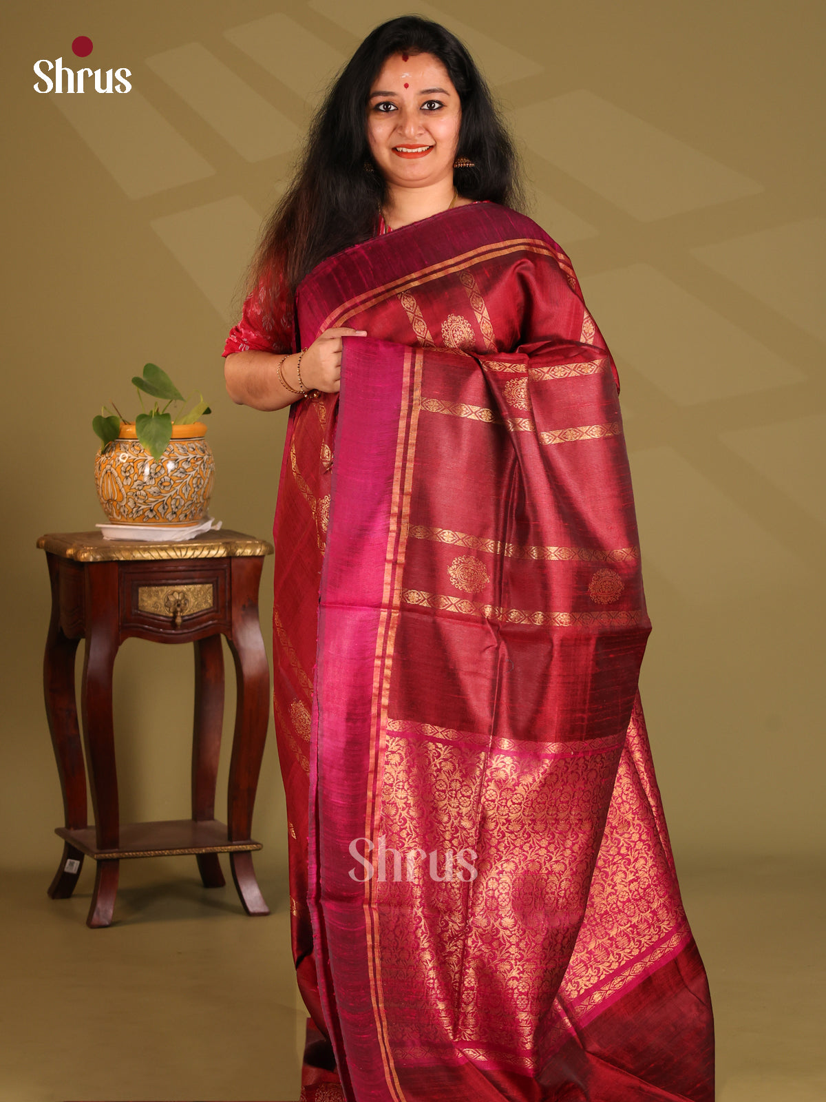 Pretty Maroon Raw Silk Saree gleams with gold zari stripes , motifs , self brocade pallu