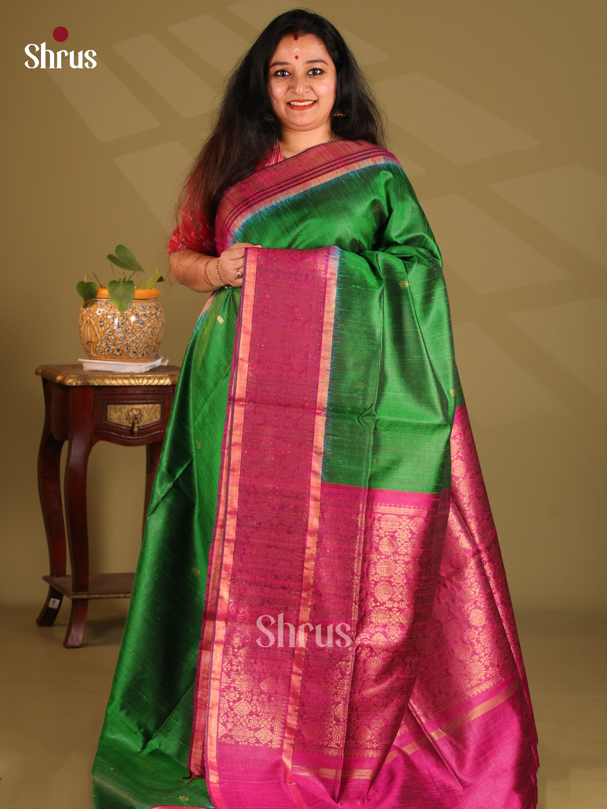 Beautiful Green Raw Silk Saree with golden zari buttas , contrast purple floral border - Shop on Shrus.com