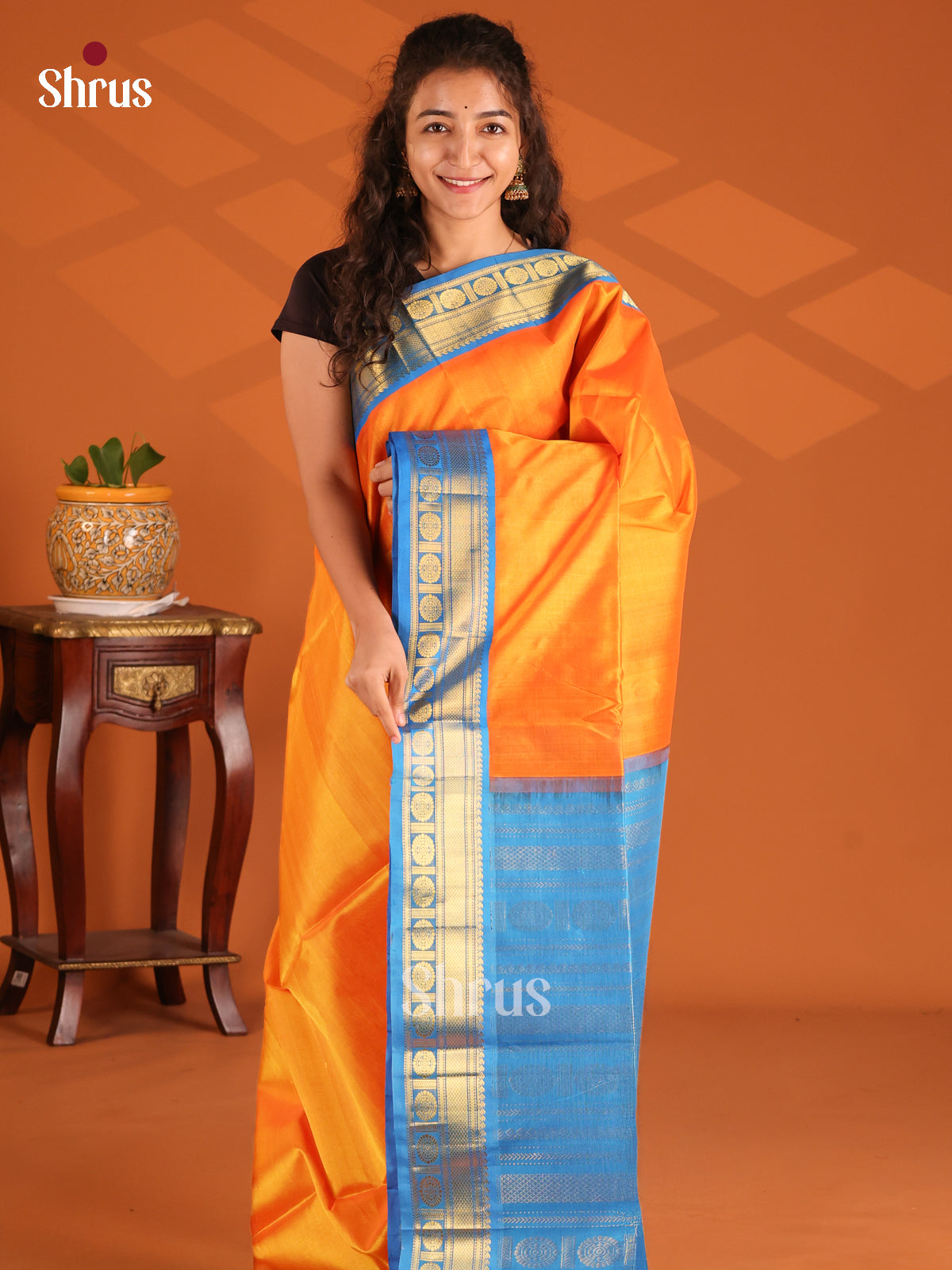 Radiant Orange Silk Cotton Saree with plain body & Blue zari border - Shop on Shrus.com